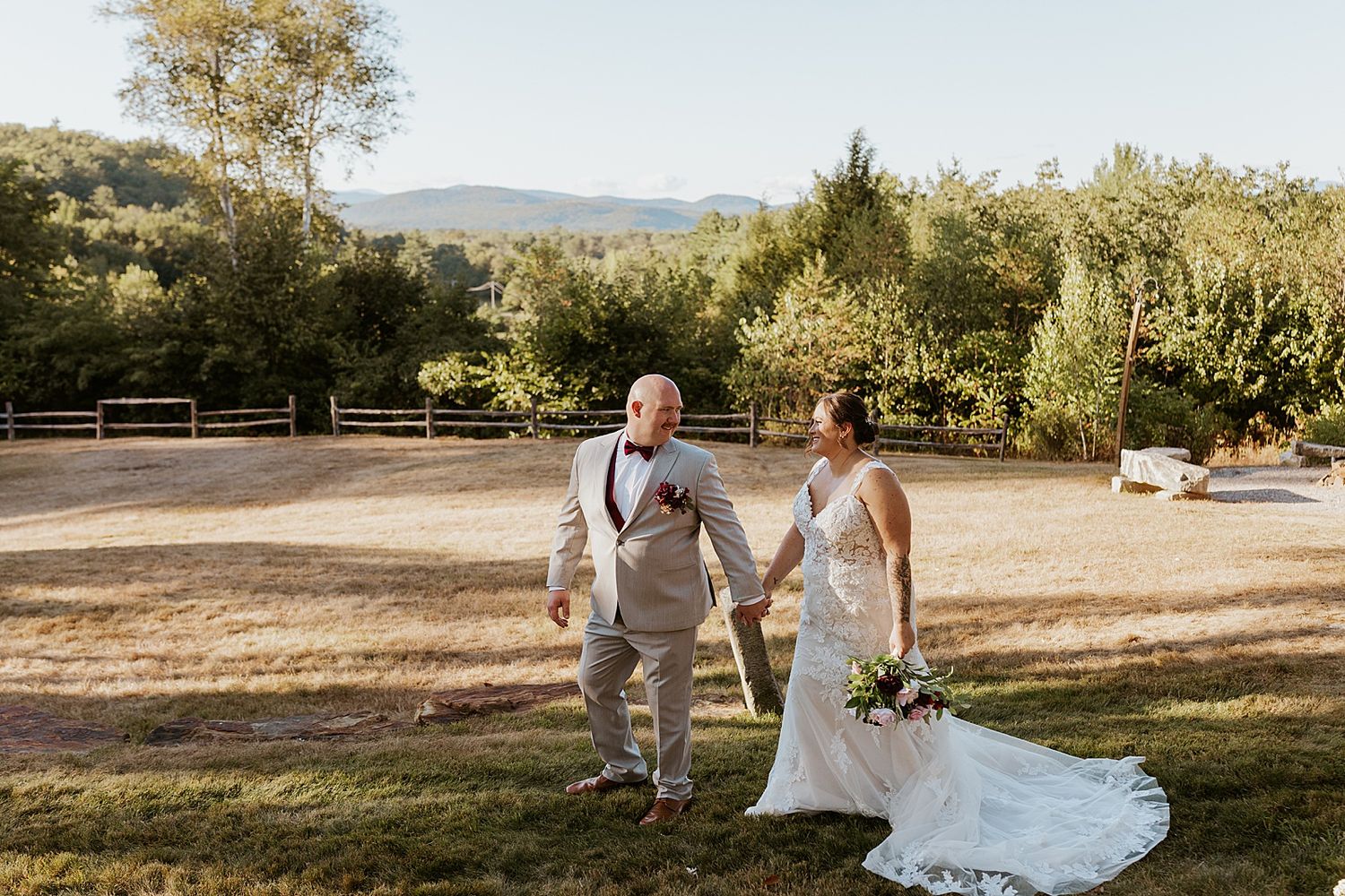 Bride and groom taking portraits at golden hour at their wedding in the New Hampshire mountains
