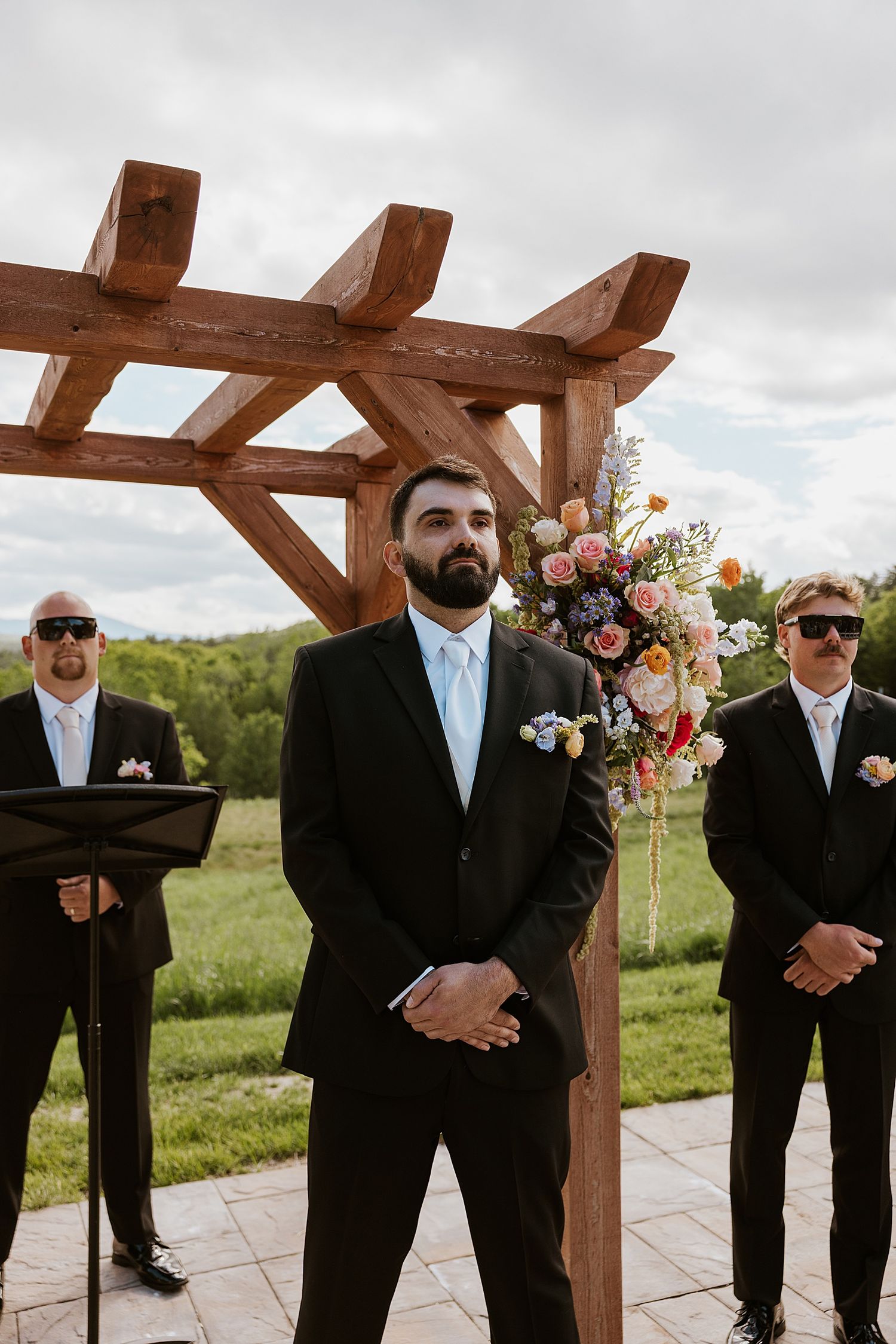 Groom waiting at the altar at his NH wedding ceremony at Longlook Farm