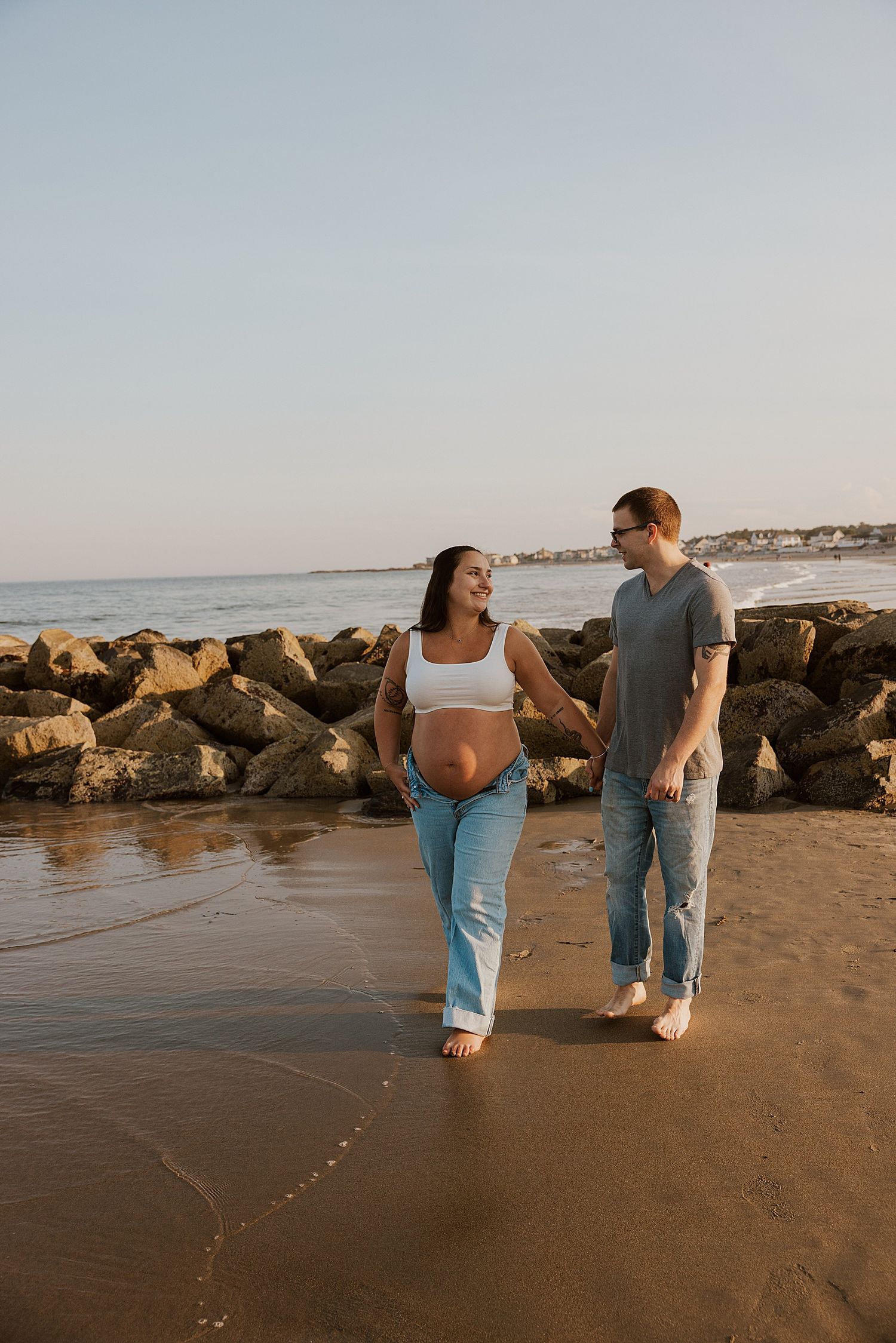 New Hampshire couple taking beach maternity pictures