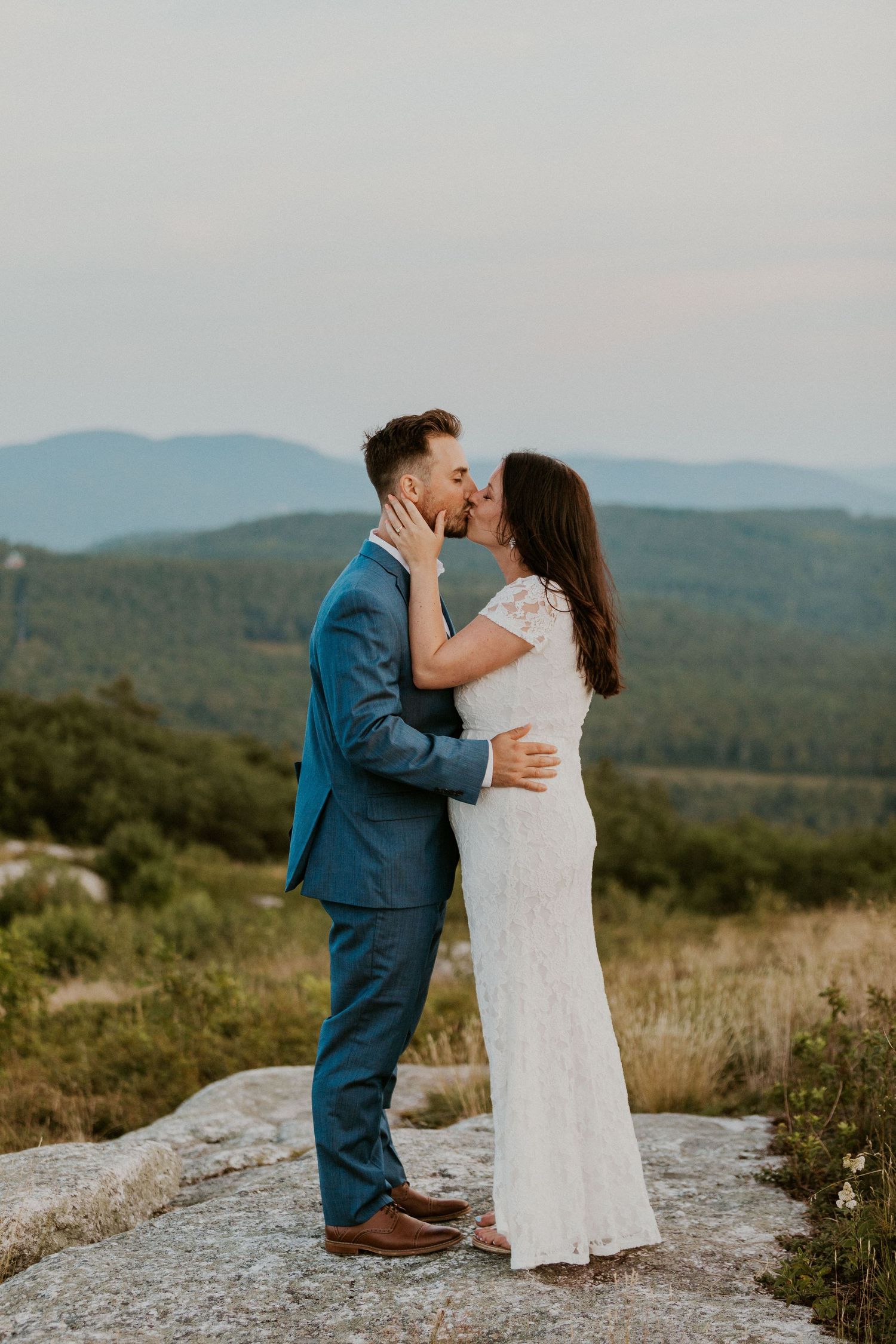 Danielle and Colin dressed in their wedding attire for their one year anniversary photoshoot on Foss Mountain in NH.