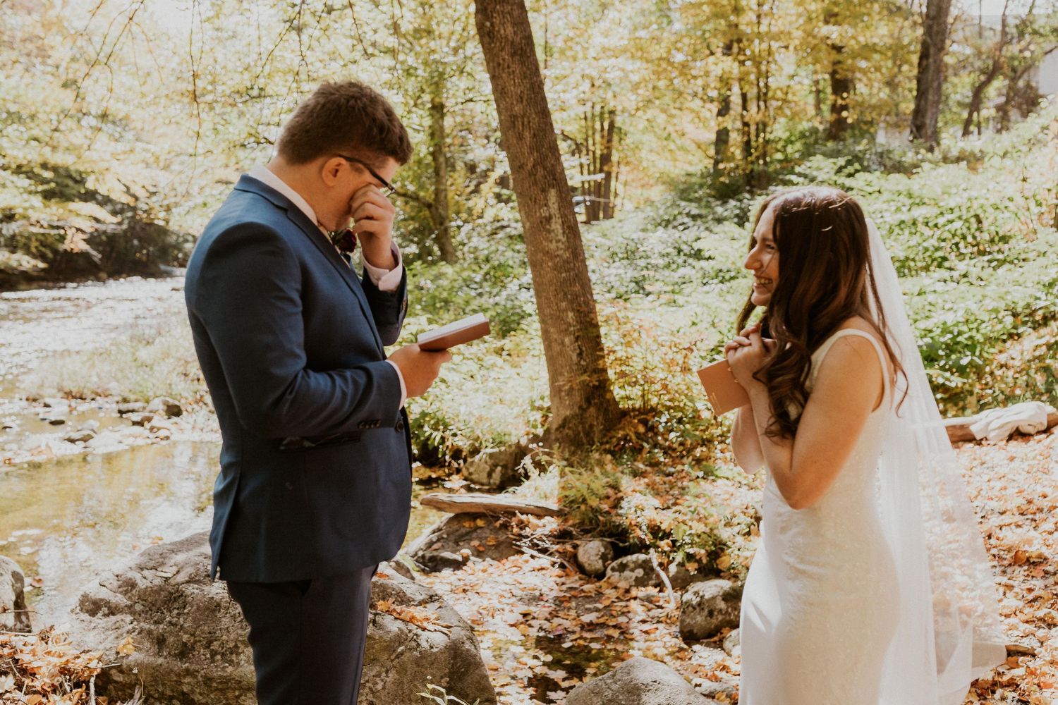 Daniel reading his private vows to Briana along the Pemi River in Woodstock New Hampshire.