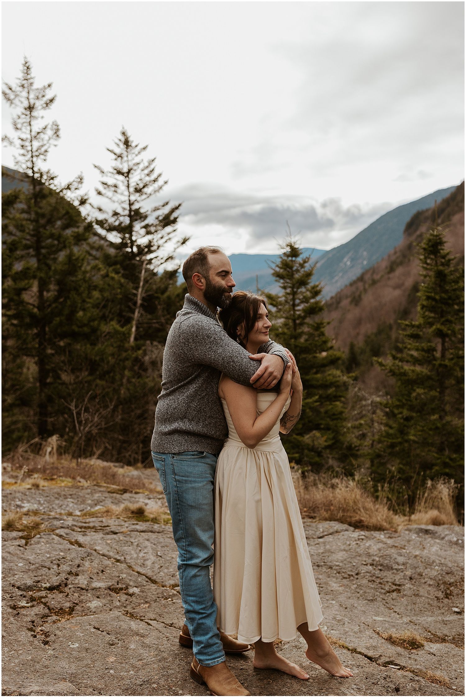 Couple taking boho engagement photos in the White Mountains NH