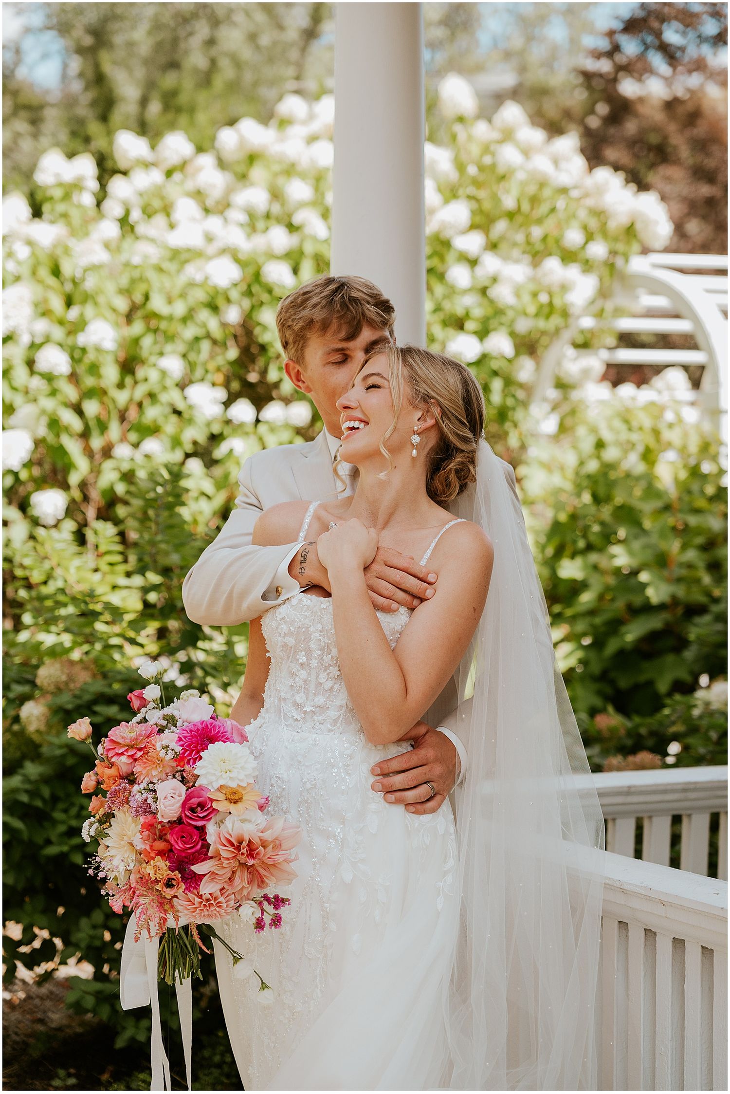 Bride and groom taking portraits at their Winthrop Carter House wedding
