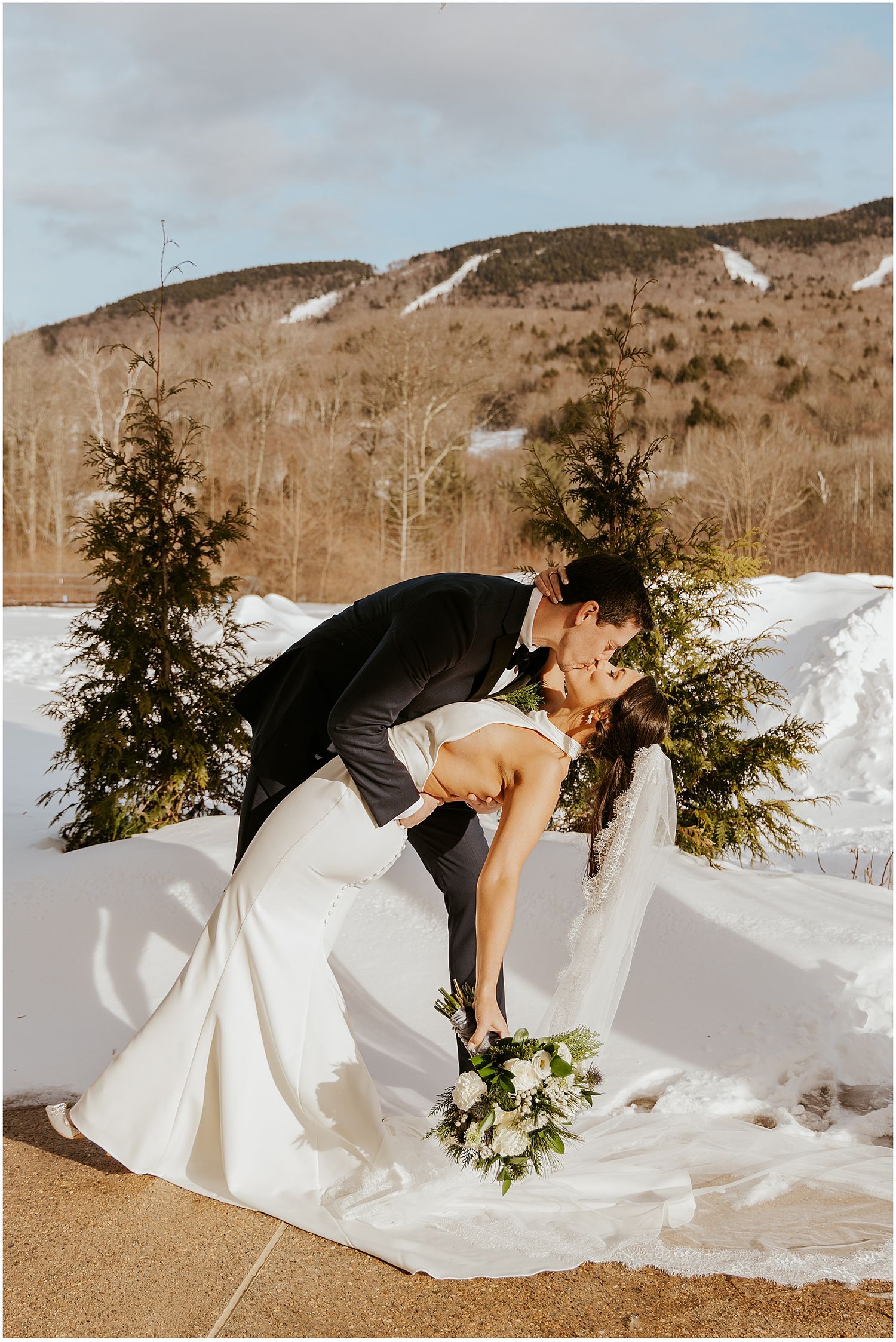 Bride and groom taking portrait photos at their Loon Mountain wedding at the River Walk Resort