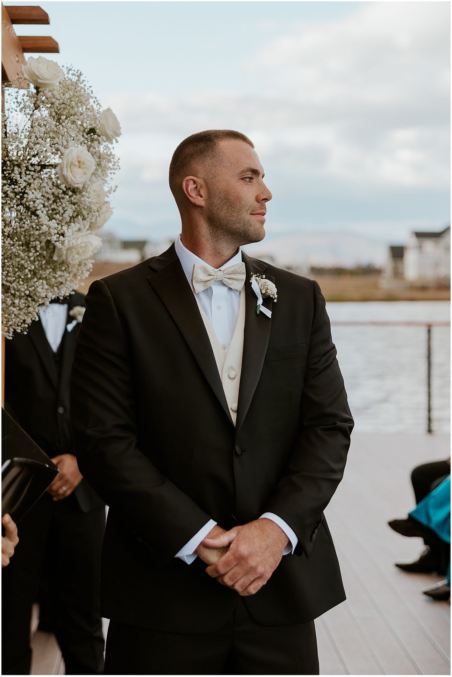 Groom waiting at the altar at the Owls Nest Resort, one of the best outdoor wedding venues in NH