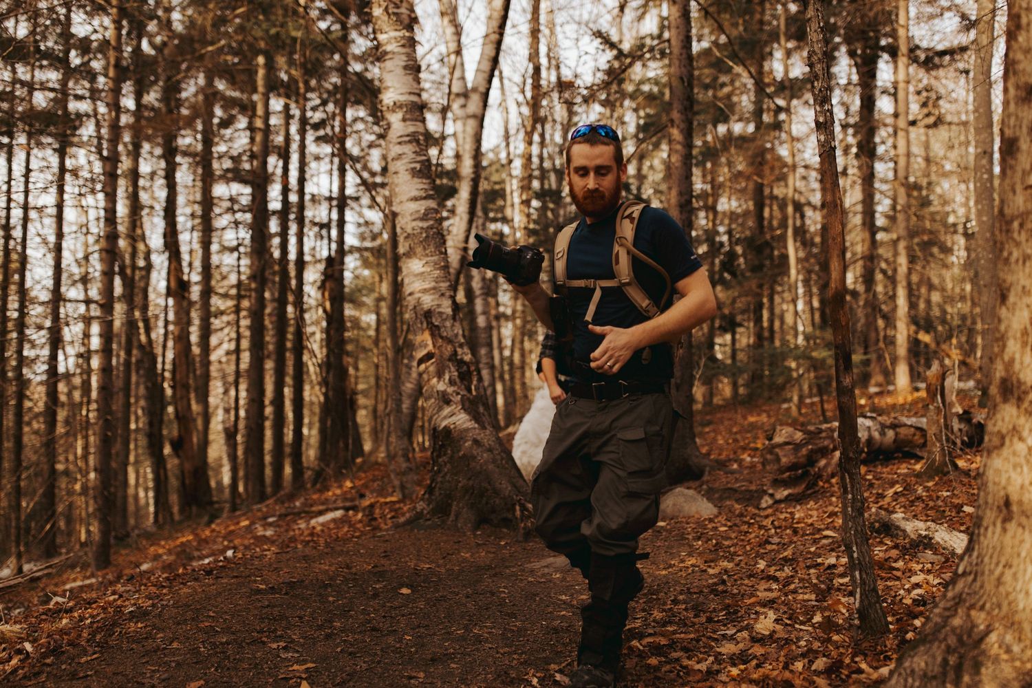 Jackie and Andy Brosonski hike the West Ridge Trail on Mount Cardigan in their wedding attire.