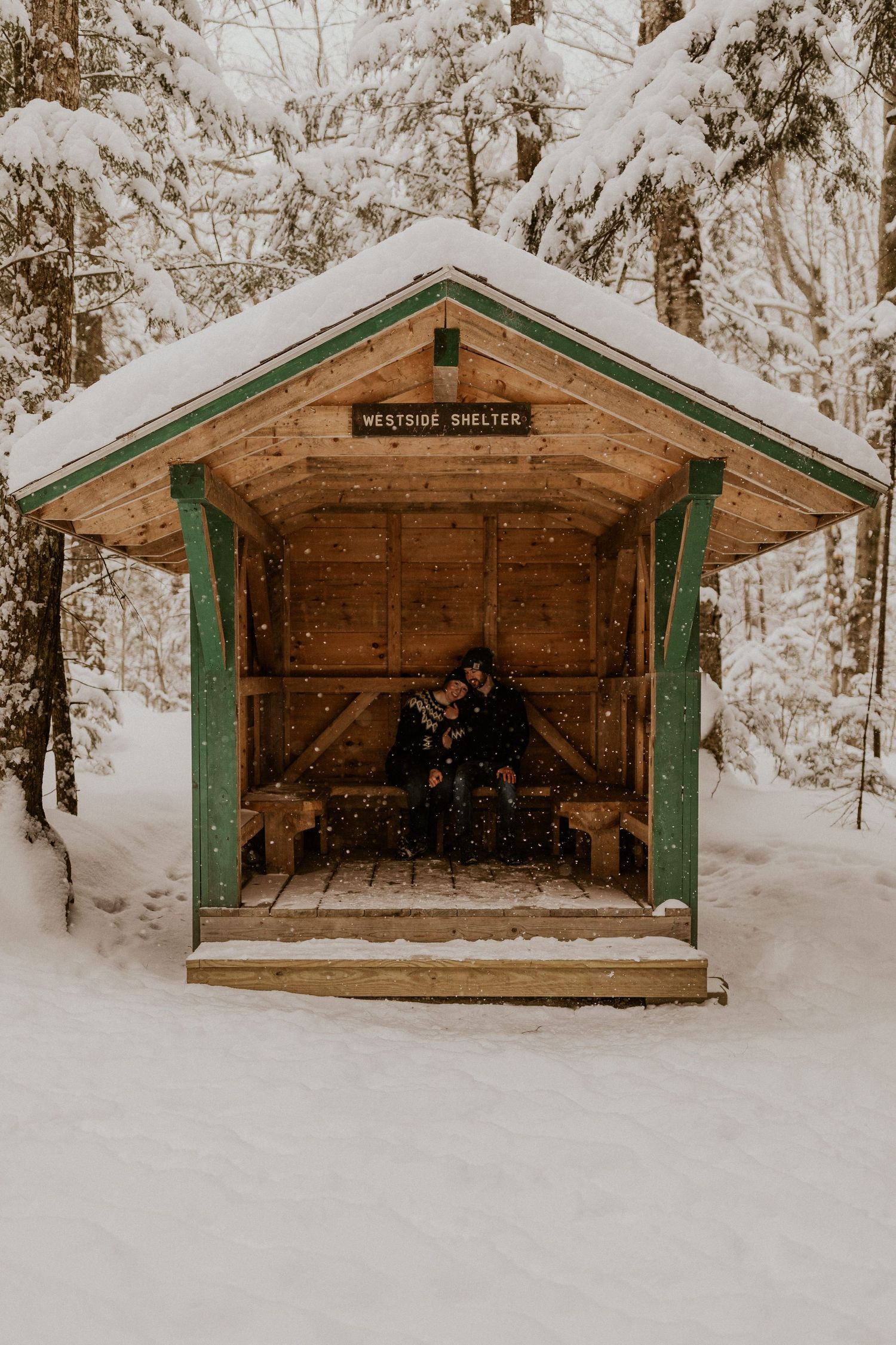 Taylor and Ken snuggling up together in a White Mountain National Forest Shelter while hiking the Flume Gorge in NH.