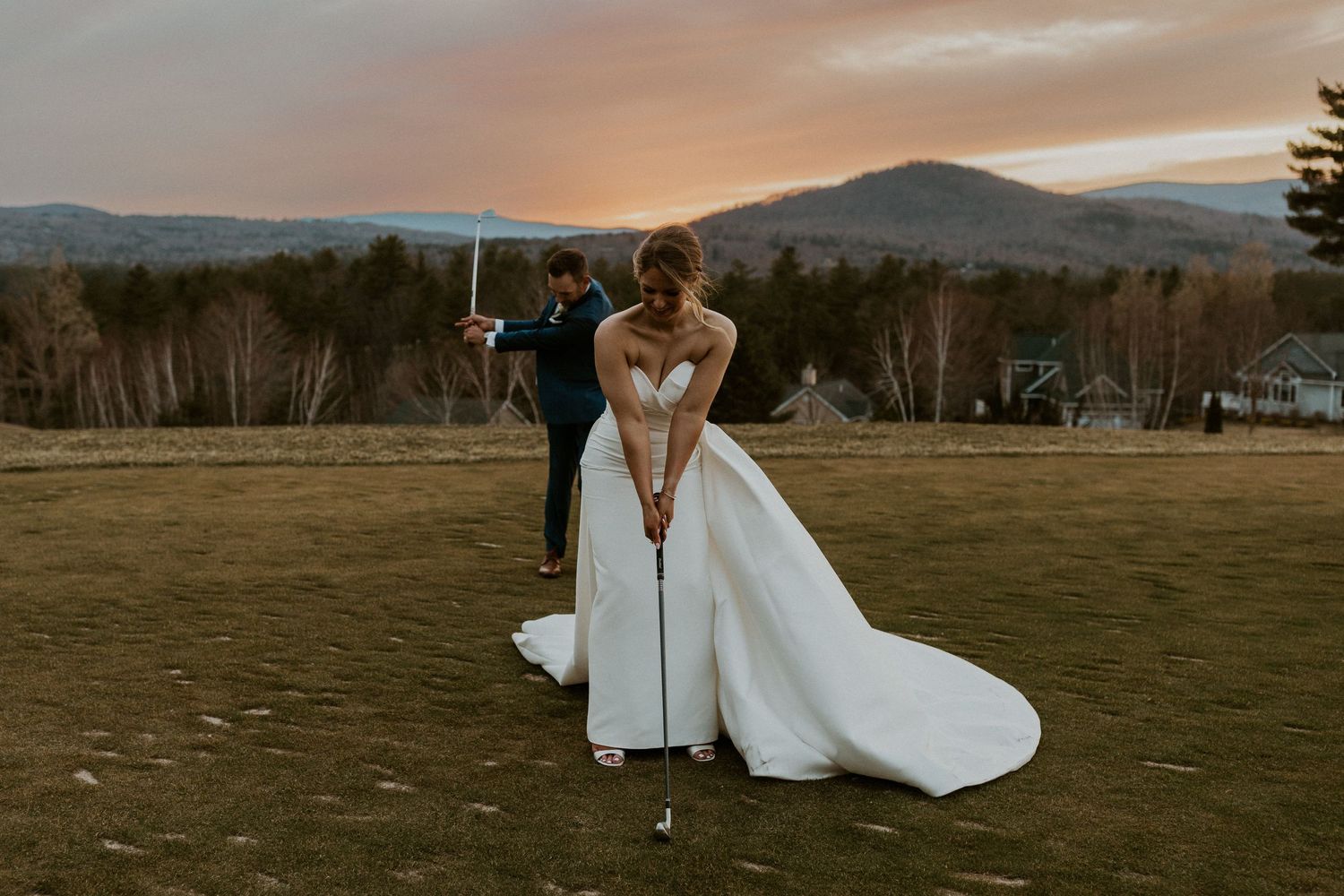 Kendra and Andrew golfing at Owl's Nest Resort in their wedding attire