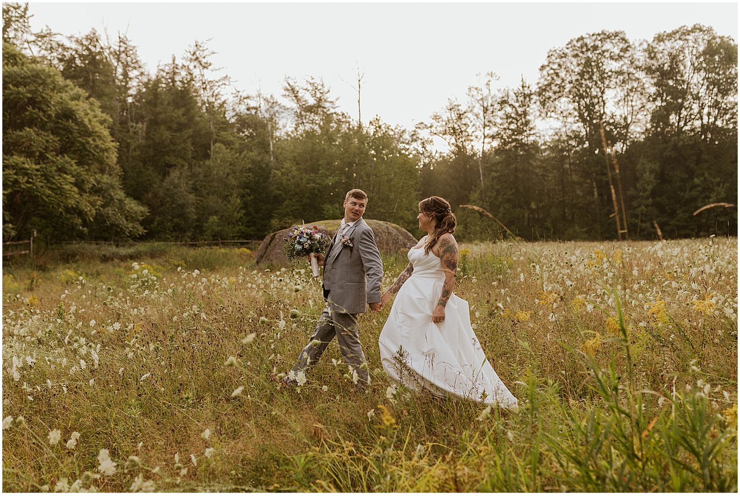 NH couple at their wedding with 2 photographers