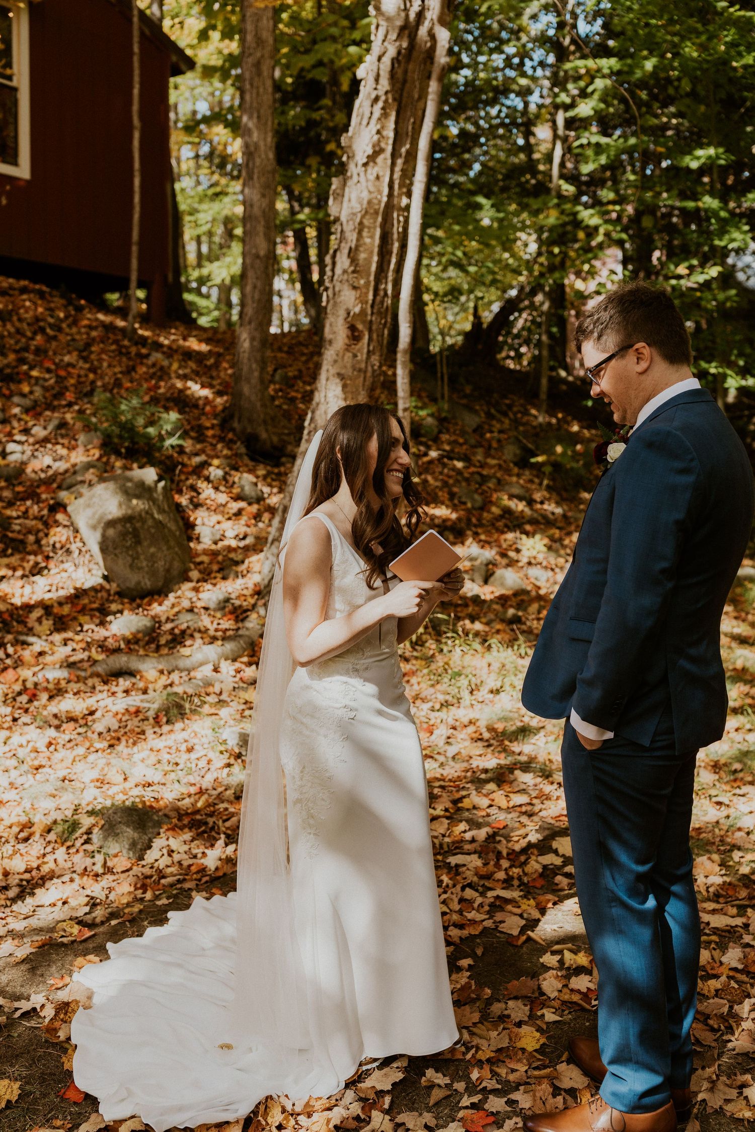 Briana reading her private vows to Daniel along the Pemi River in Woodstock New Hampshire.