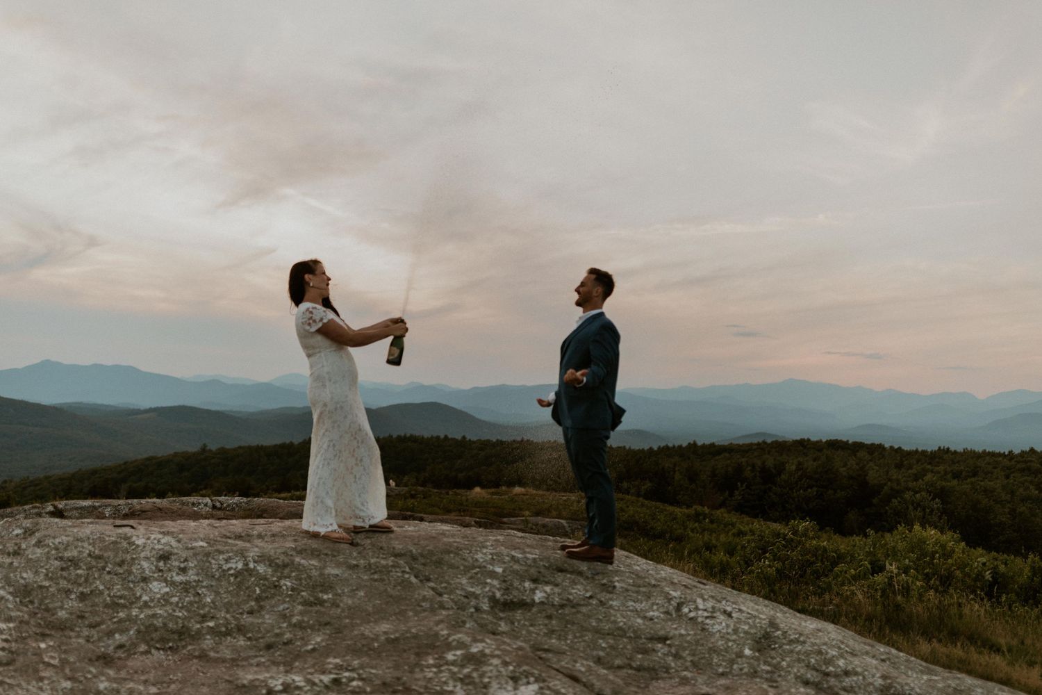 Danielle and Colin dressed in their wedding attire for their one year anniversary photoshoot on Foss Mountain in NH.