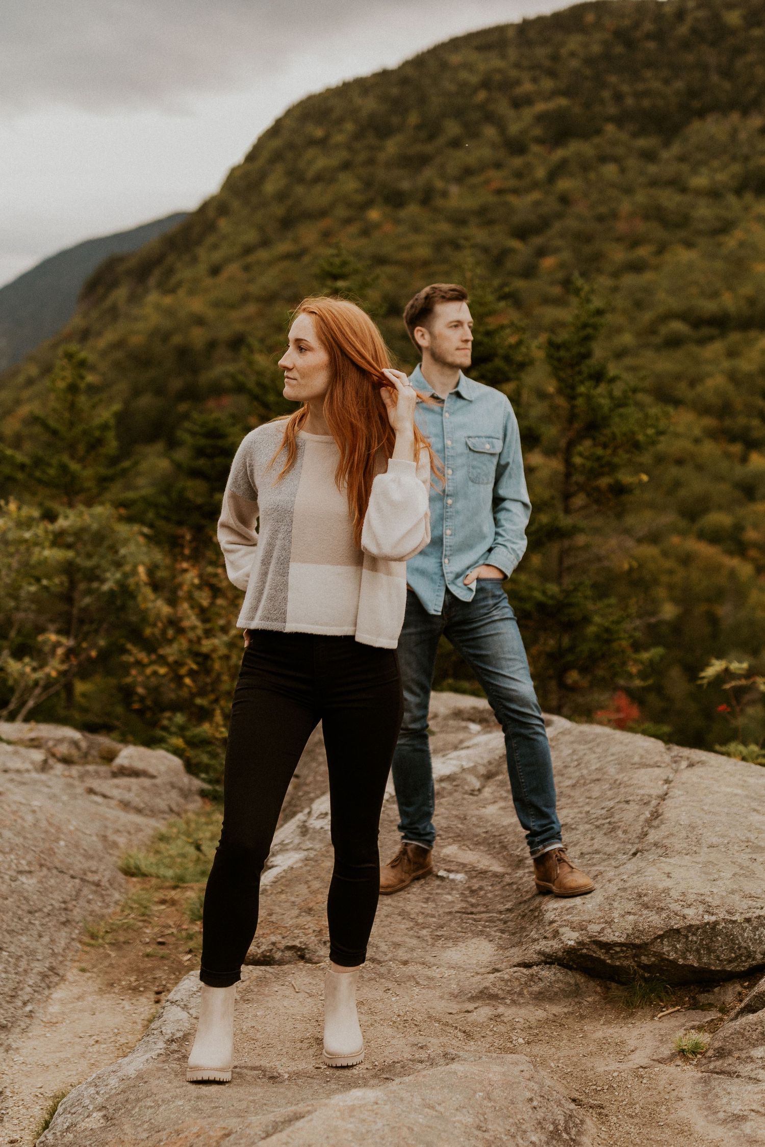 Sam and Colin posing for a portrait together on a mountain top in Crawford Notch.
