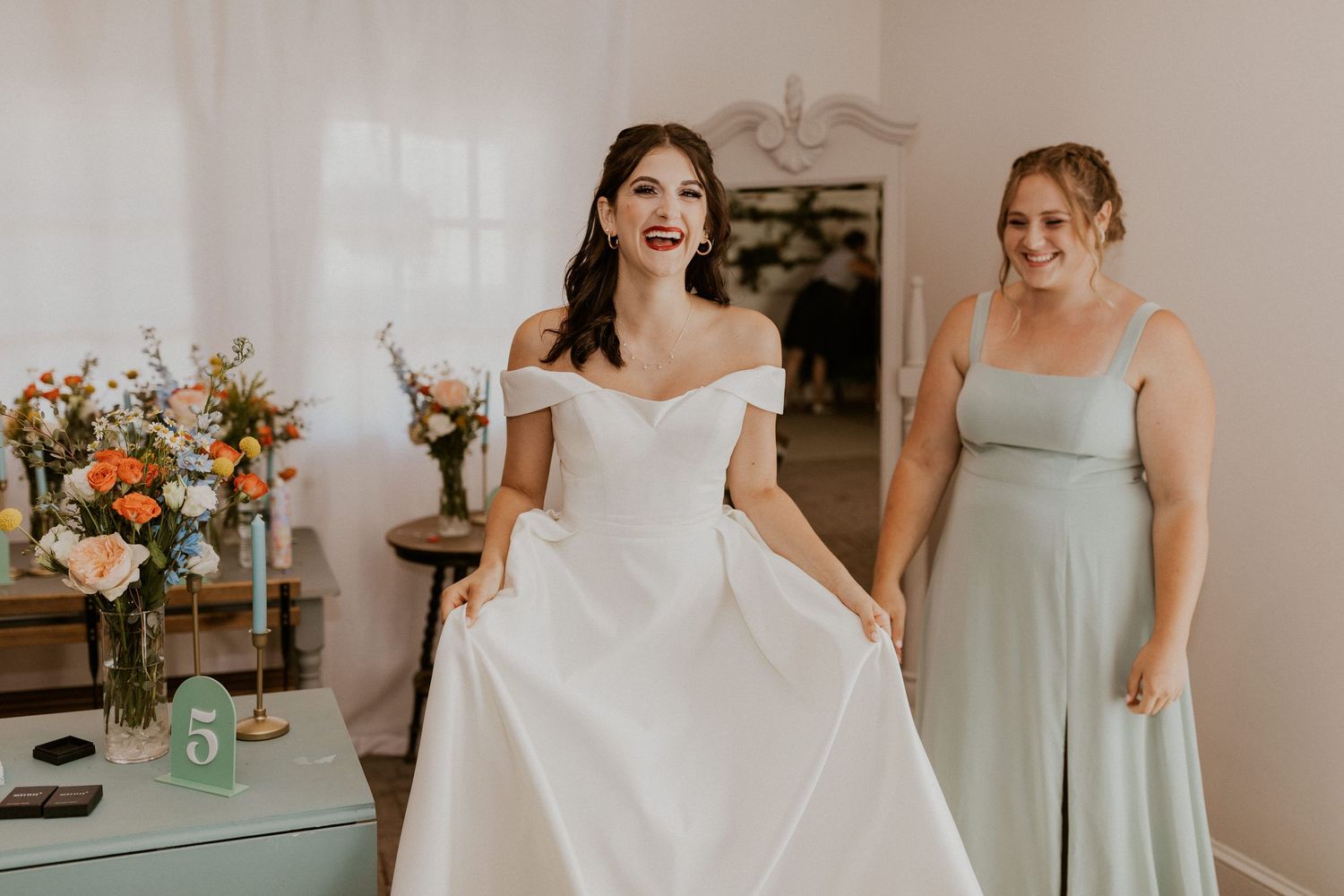 Wedding celebration with bridesmaids in light blue dresses and floral decorations.