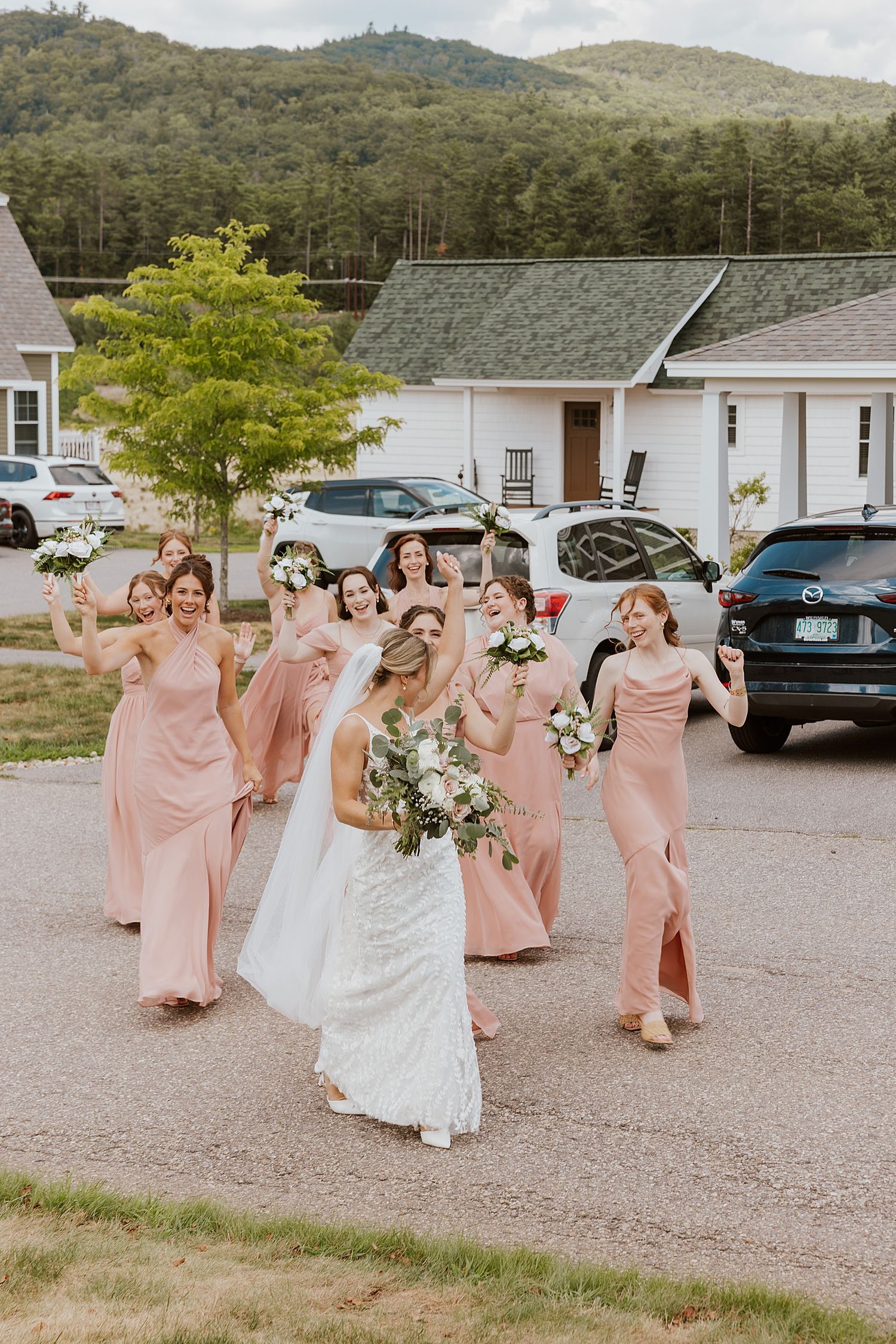 Bride and bridesmaids walking to the Sunset Pavilion at the Owl's Nest Resort in New Hampshire