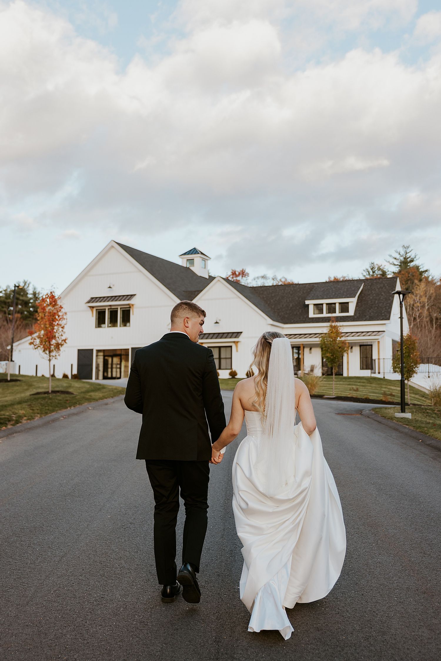 Couple walking back to their Hyla Brook Estate wedding ceremony