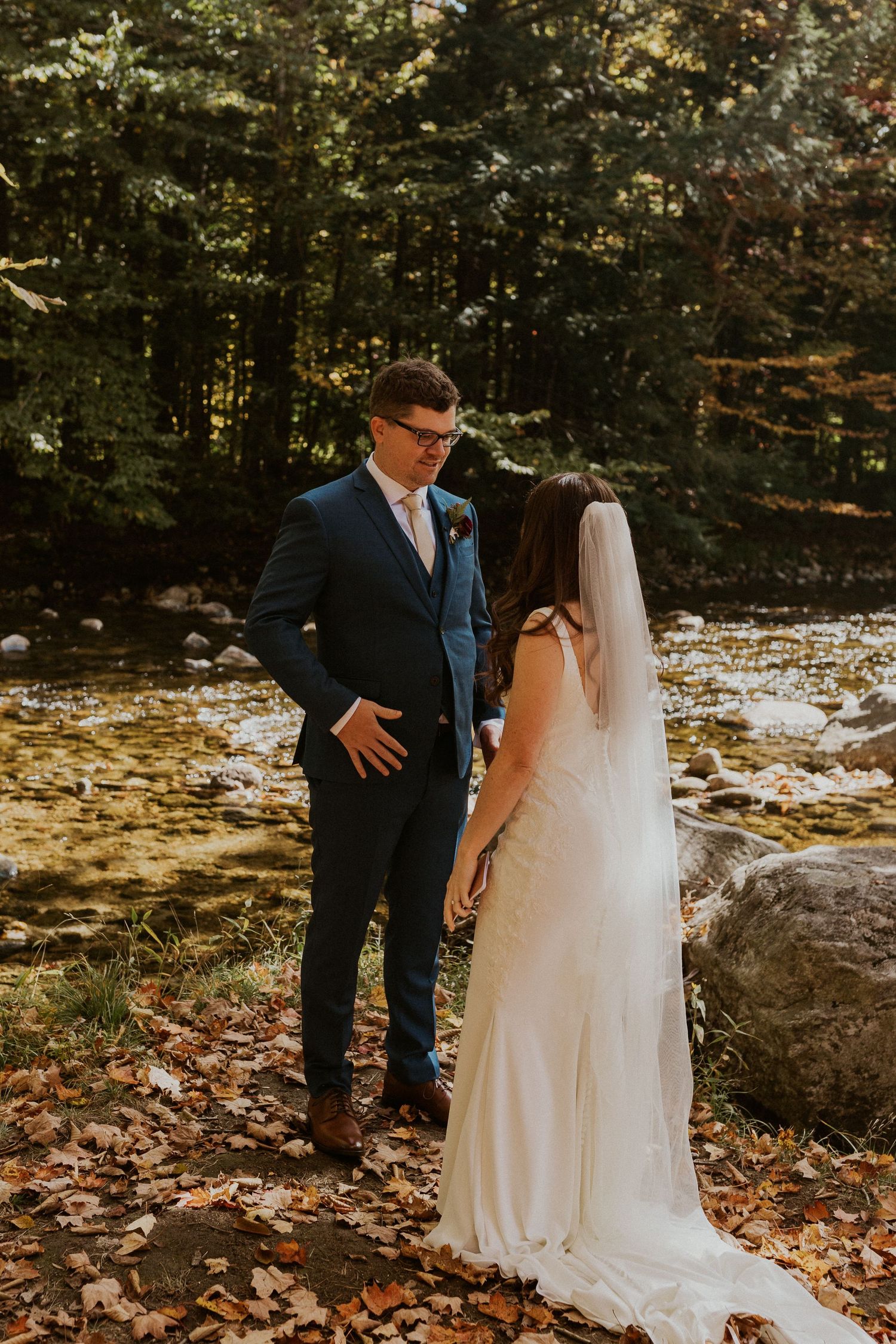 Daniel reading his private vows to Briana along the Pemi River in Woodstock New Hampshire.