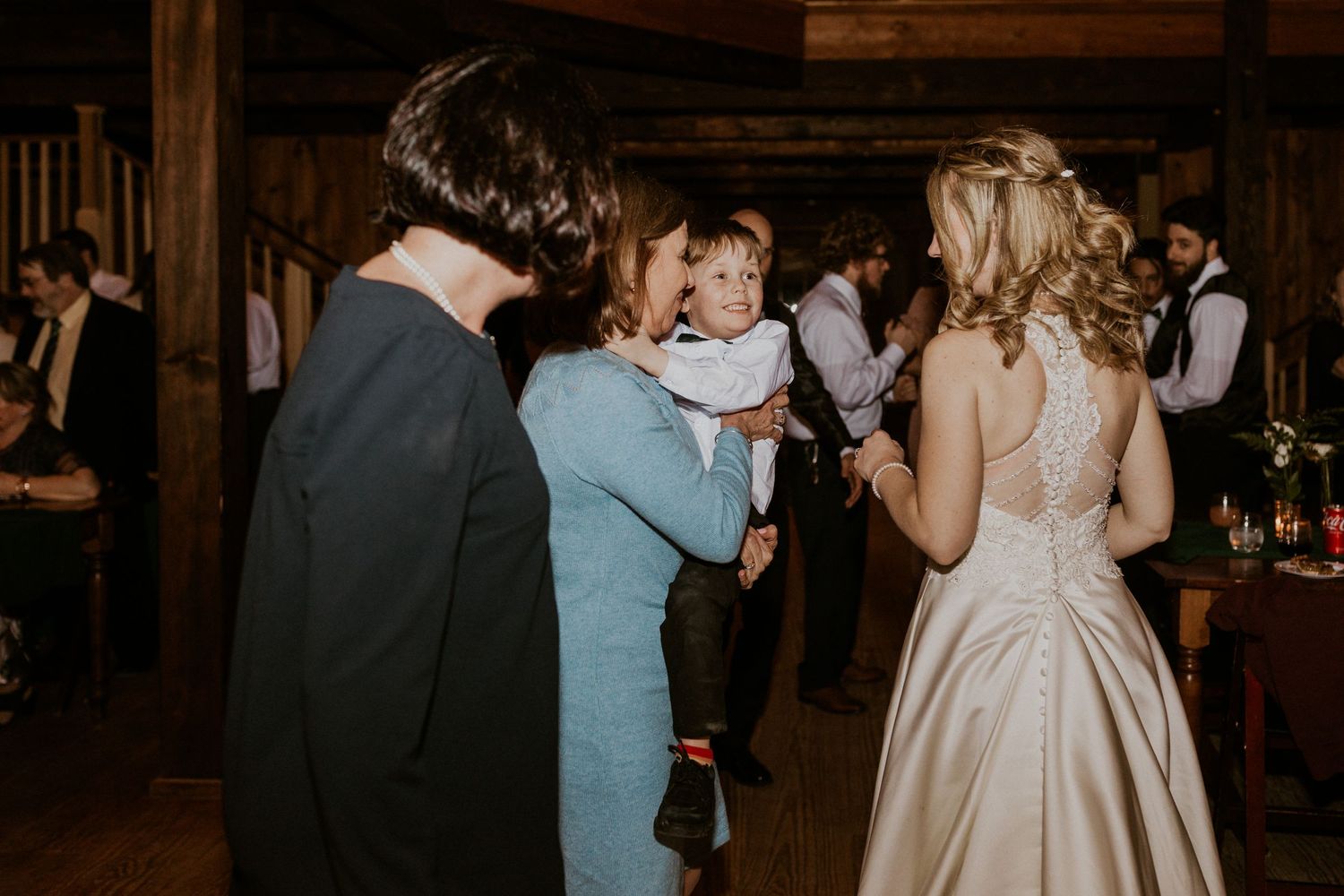 Candid photograph of Deirdre mingling with wedding guests.