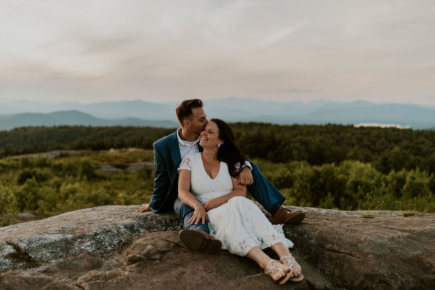 Danielle and Colin dressed in their wedding attire for their one year anniversary photoshoot on Foss Mountain in NH.