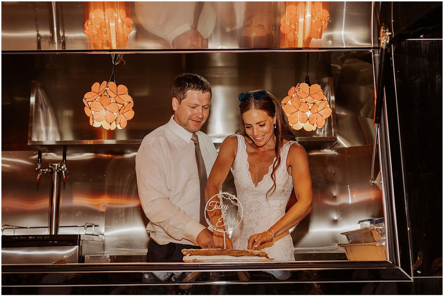 Warm glowing chandeliers create an intimate atmosphere during an evening celebration.