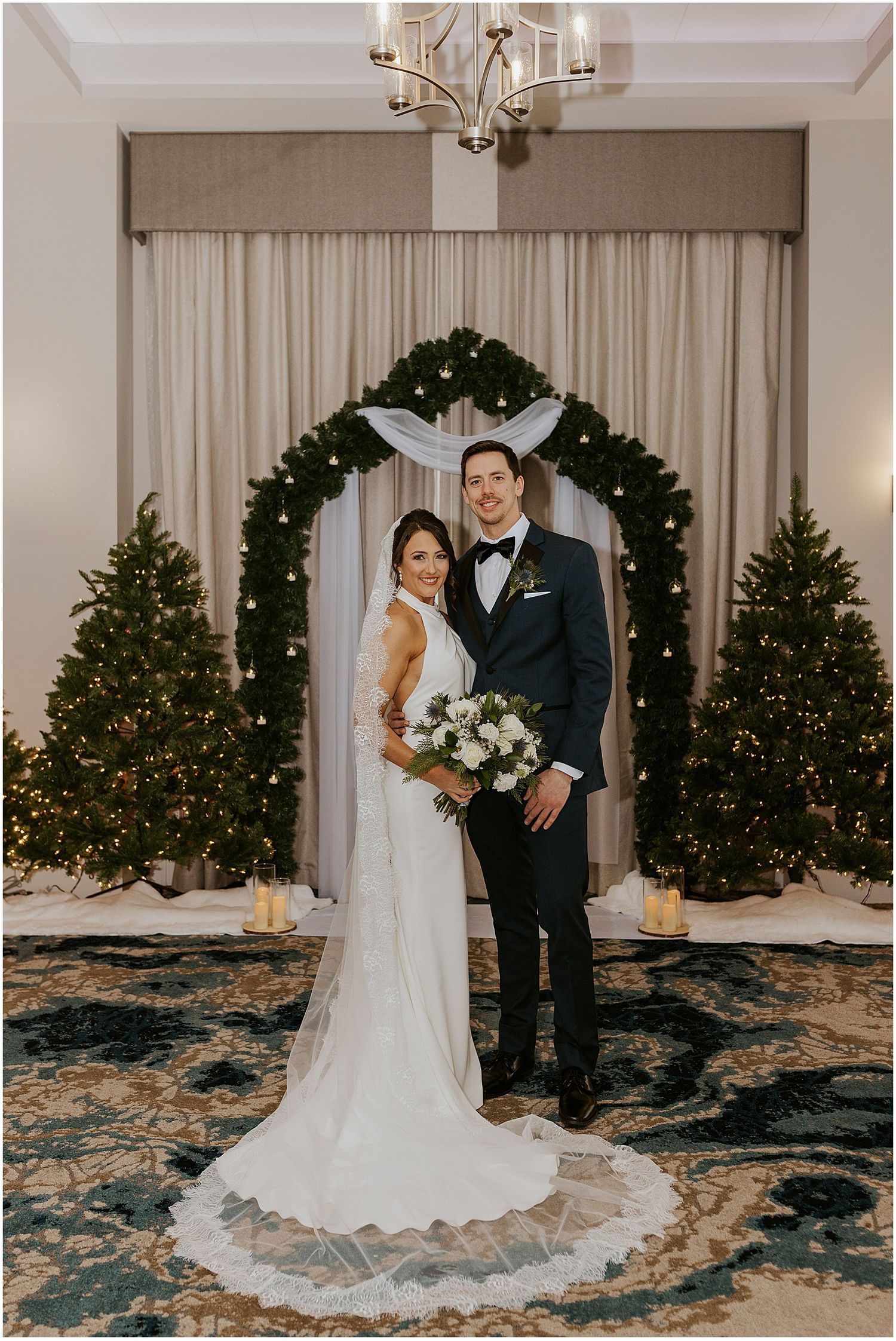 Bride and groom posing for portrait photos at their River Walk Resort wedding ceremony