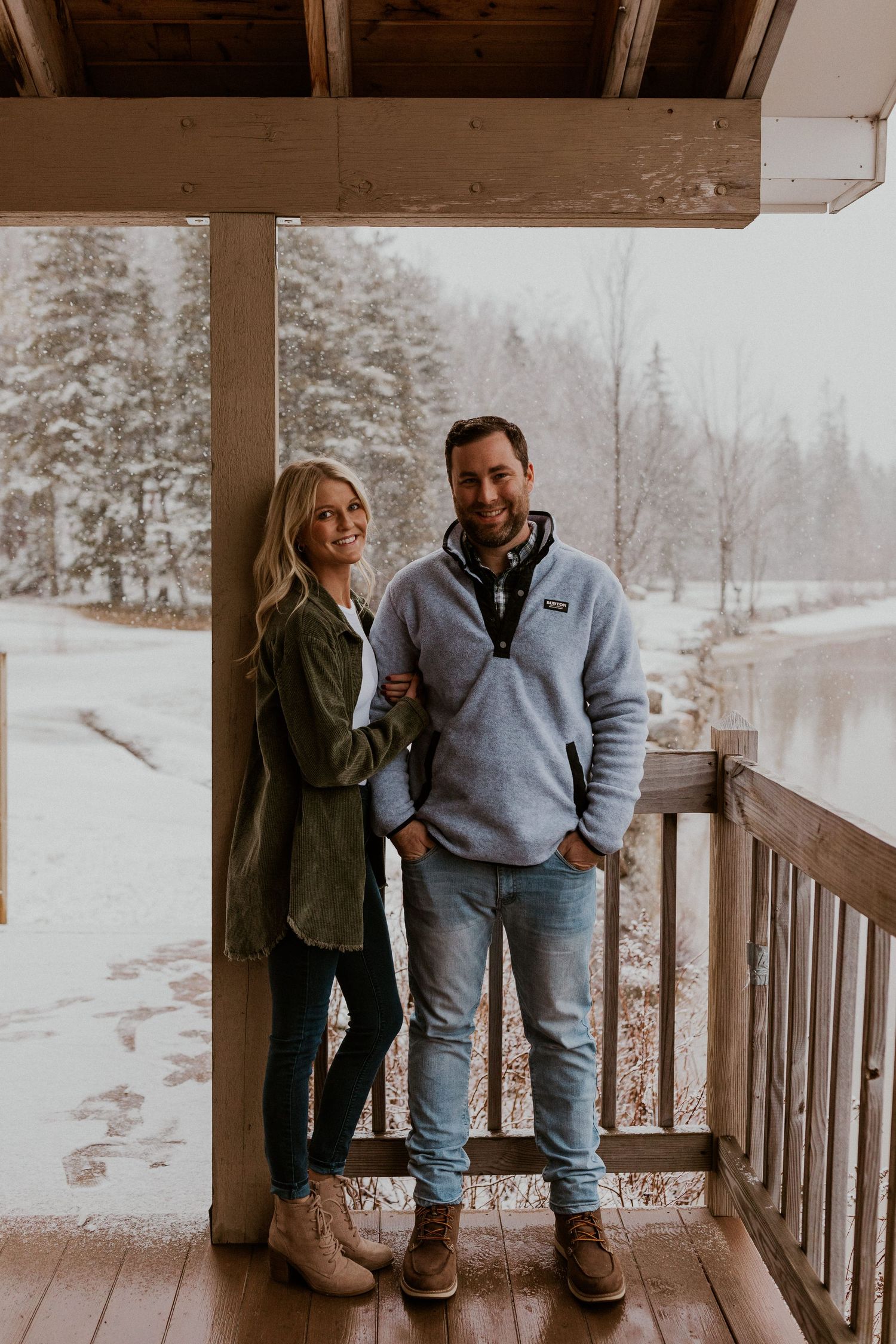 Newly engaged couple playfully posing for photos during their engagement session in Franconia New Hampshire.