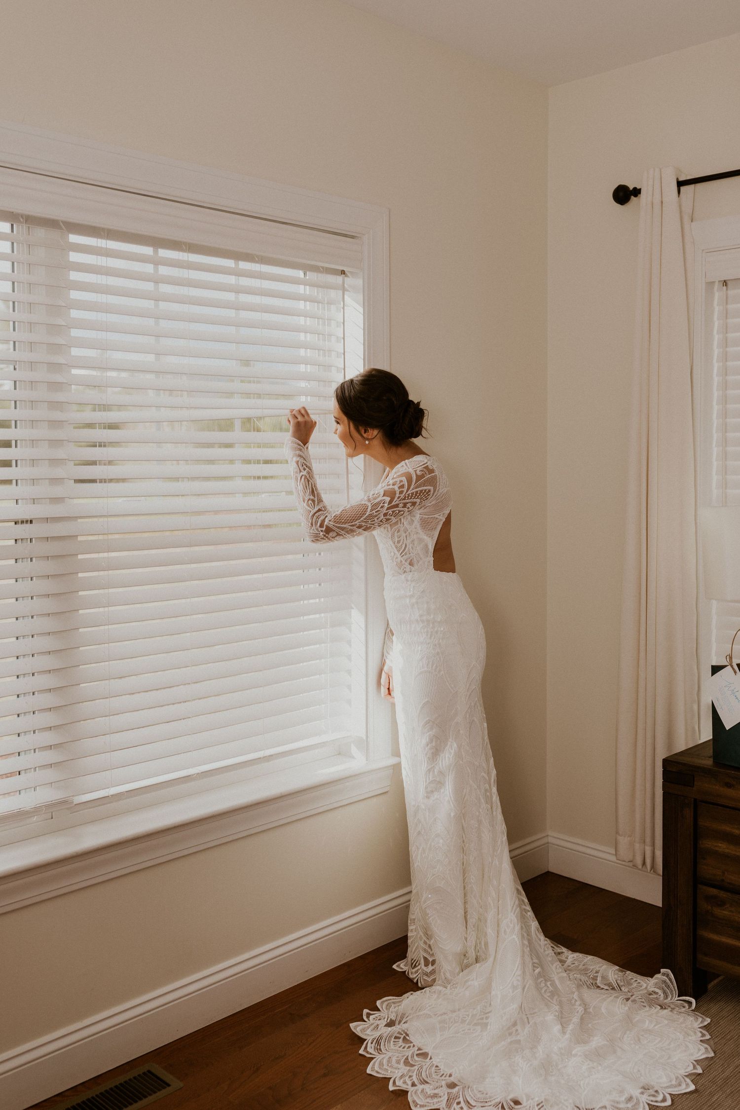 Abbie peeking out at her future husband before their first look at the Owl's Nest Resort in Thornton NH.