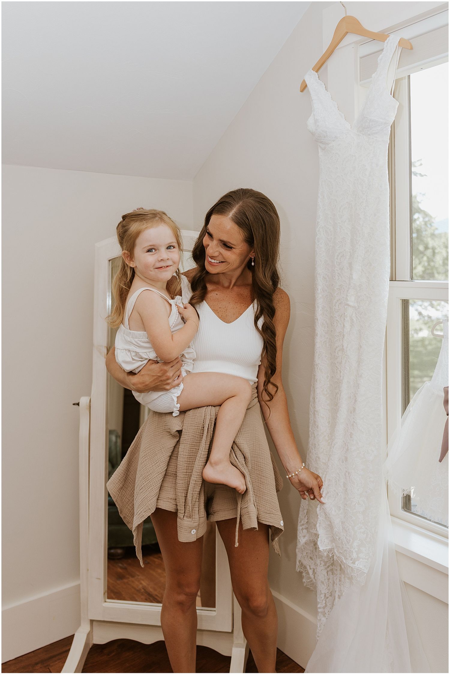 Bride getting ready with her daughter for her Whiteface Hollow wedding in NH