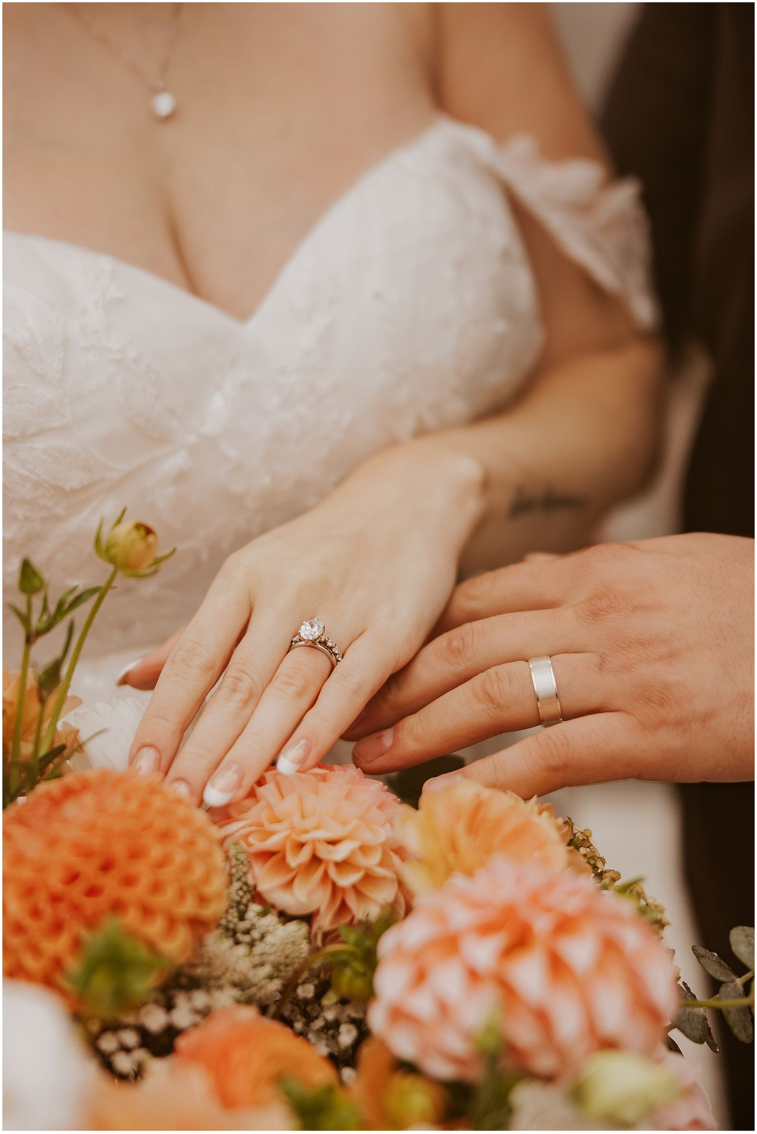 Bride and groom showing off their rings at their NH elopement