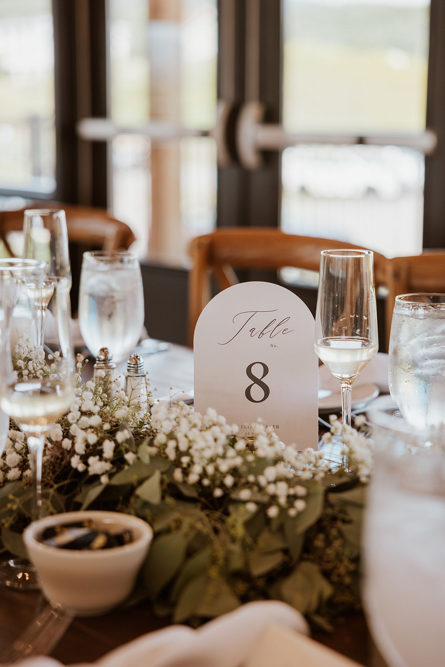 White florals and greenery for wedding reception decor at the Sunset Pavilion at the Owl's Nest Resort in NH