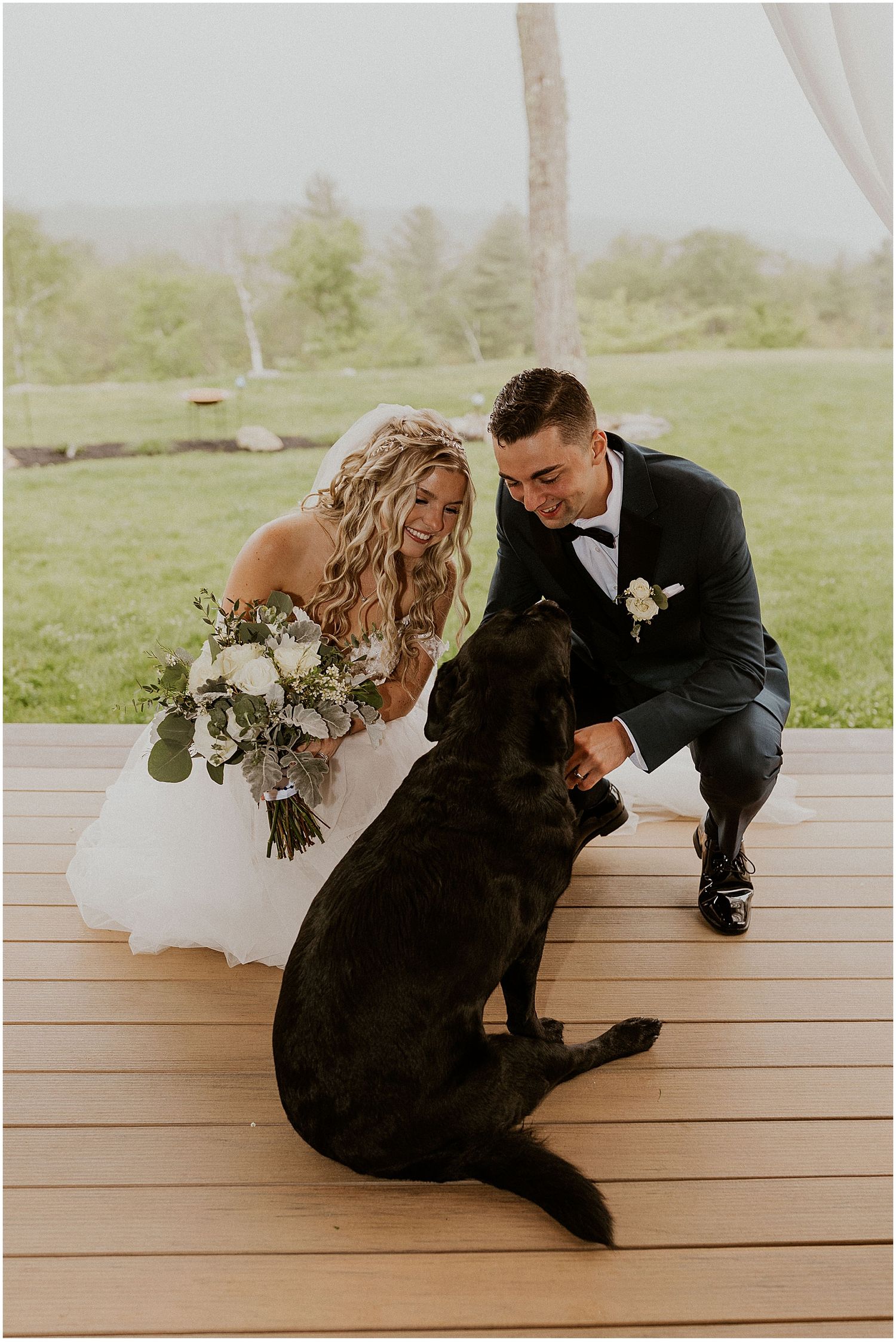 Bride and groom and their dog at their wedding