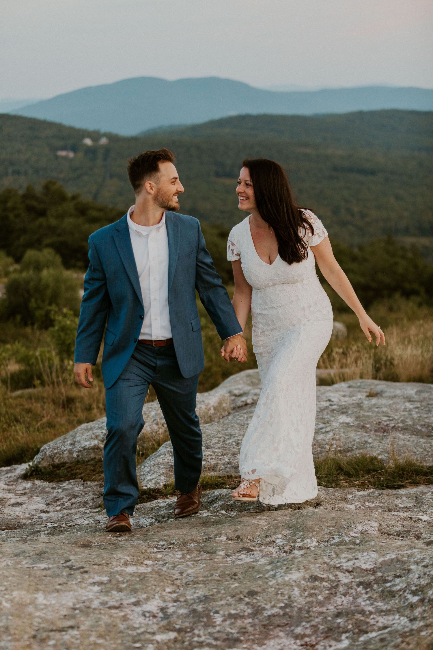 Danielle and Colin dressed in their wedding attire for their one year anniversary photoshoot on Foss Mountain in NH.