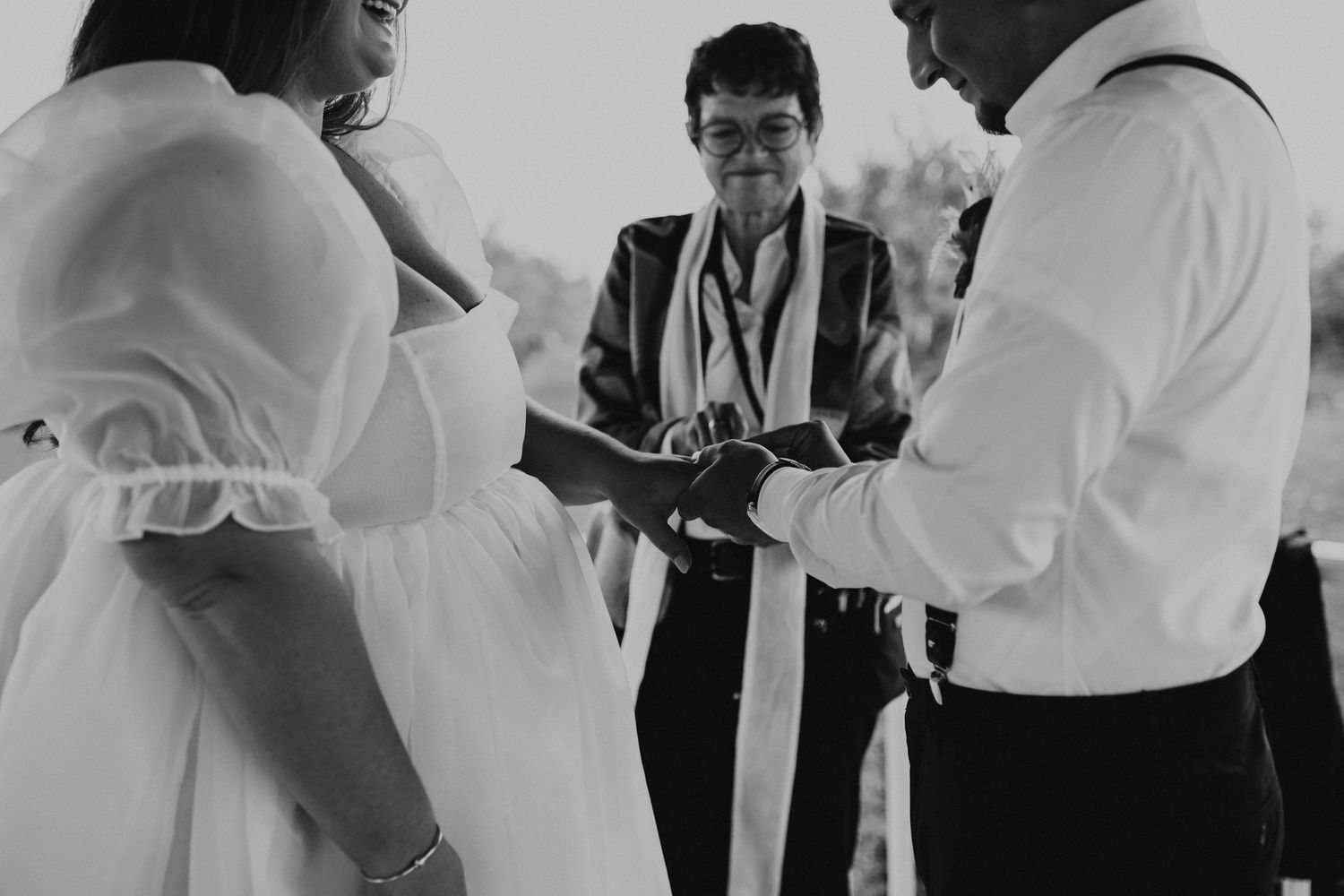 Jose placing Terise's ring on her finger during their elopement ceremony in Concord New Hampsihre
