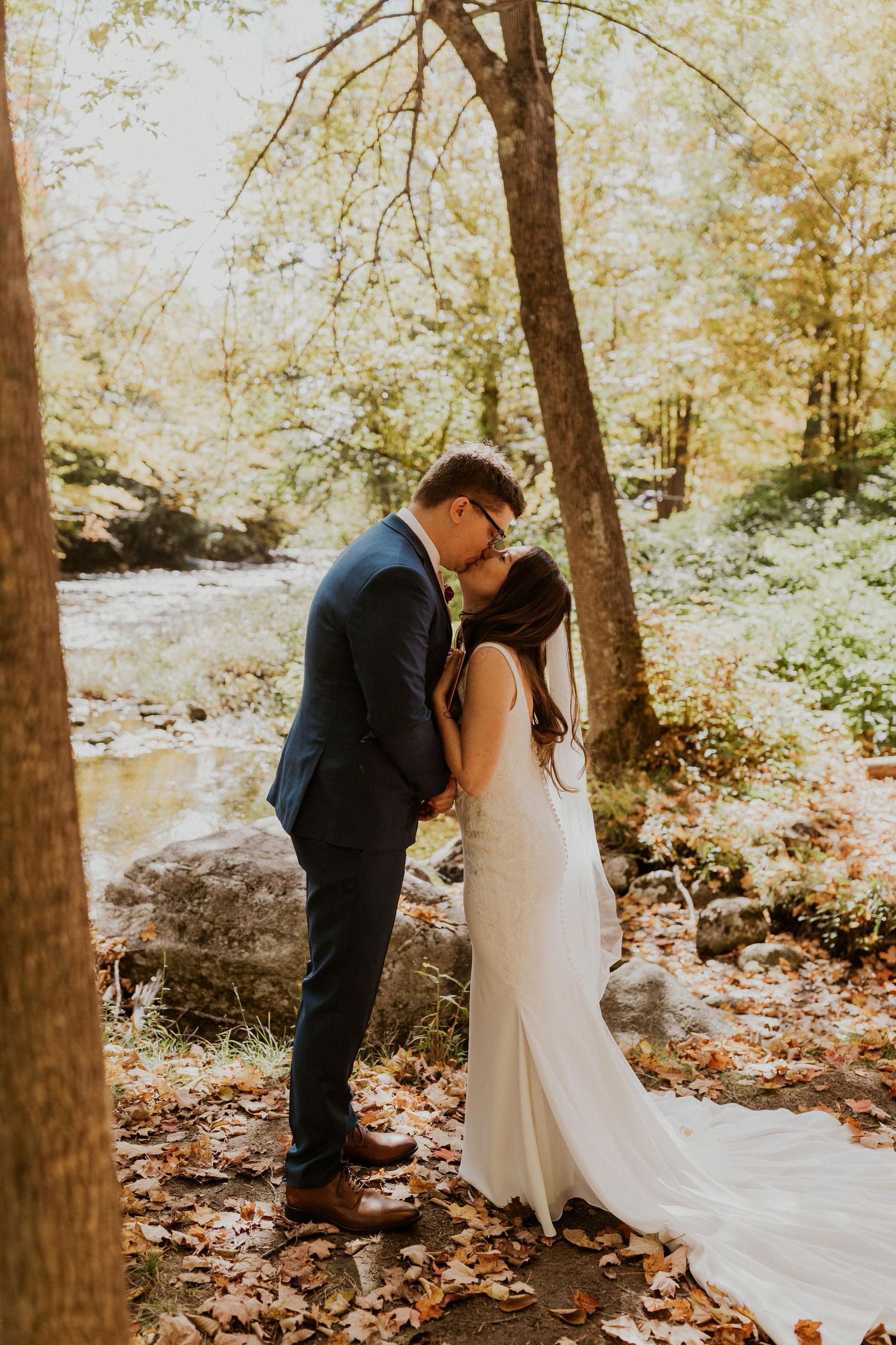Daniel reading his private vows to Briana along the Pemi River in Woodstock New Hampshire.