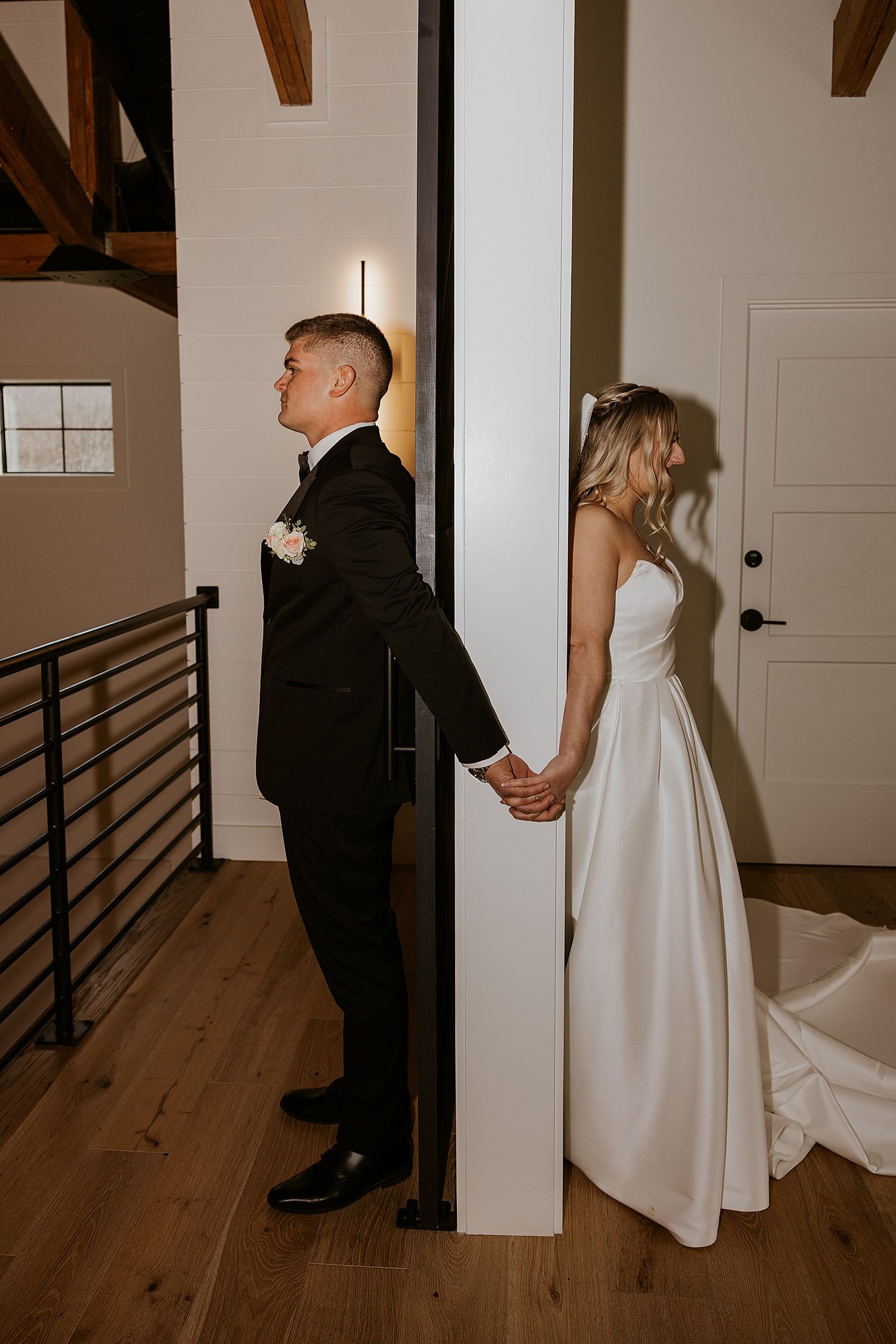 Bride and groom having a first touch moment at their Hyla Brook Estate wedding