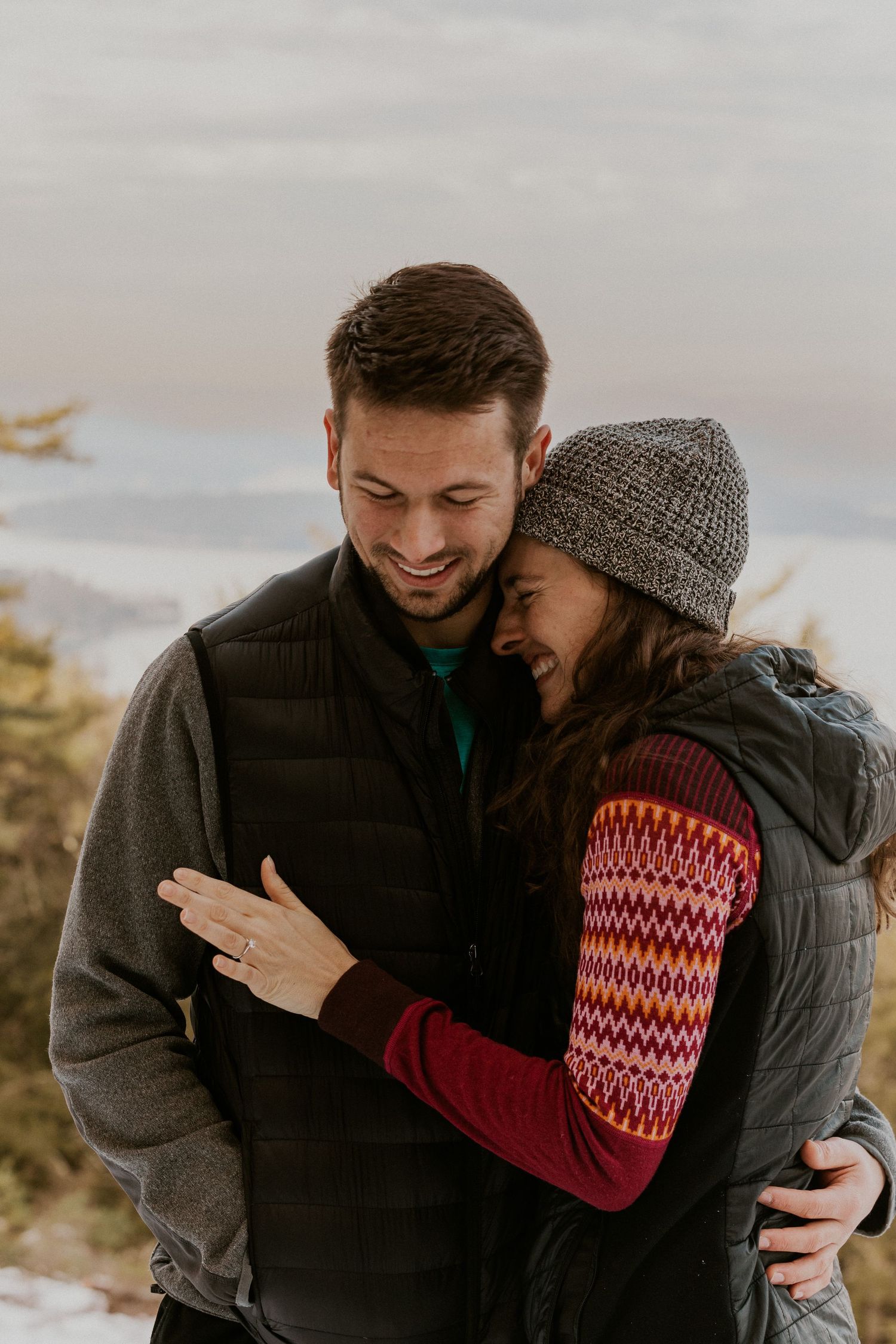 Kirsten hugging onto Ivan after he proposed to her on Lockes Hill Trail in Gilford New Hampshire.