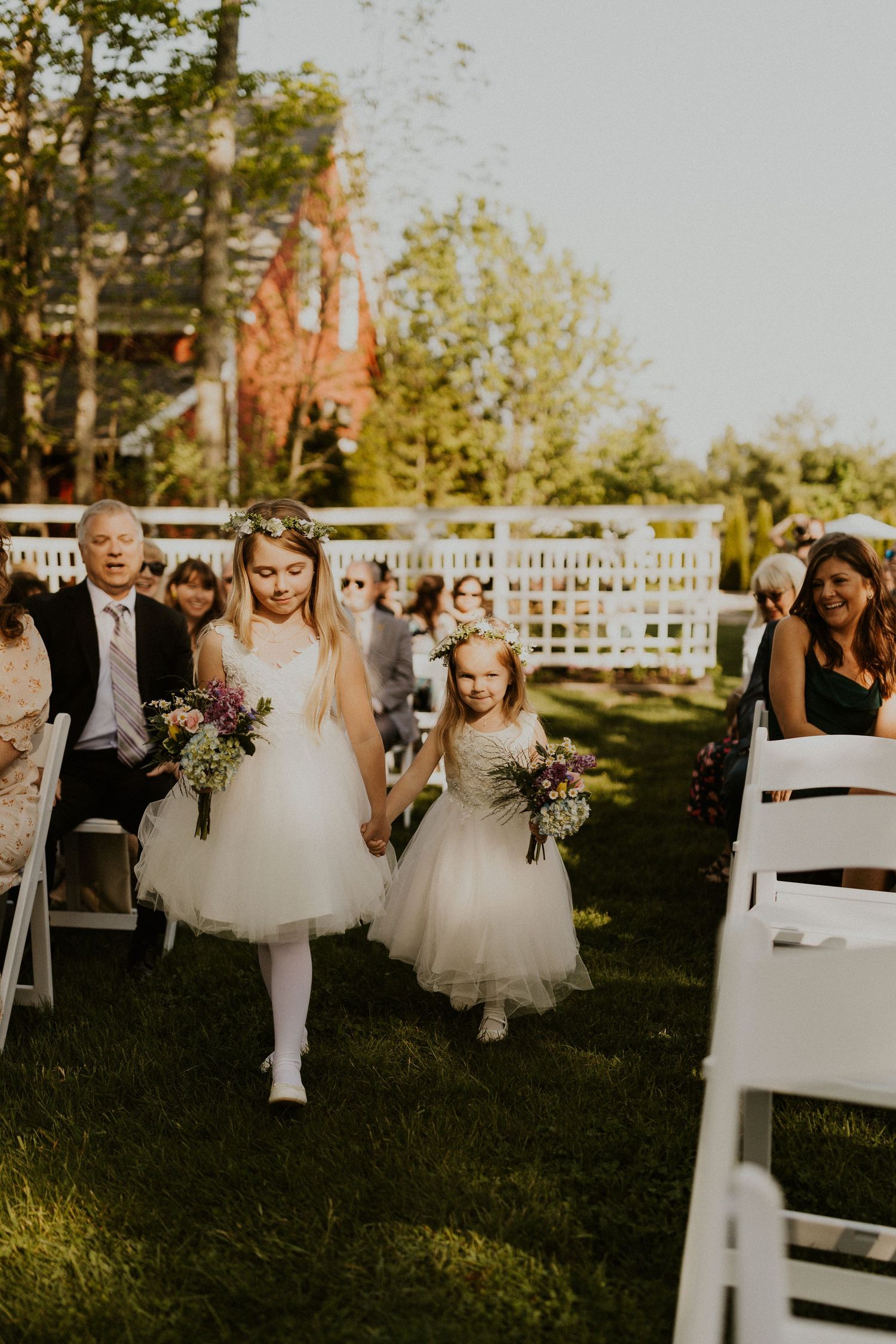 Flower girls walking down the aisle