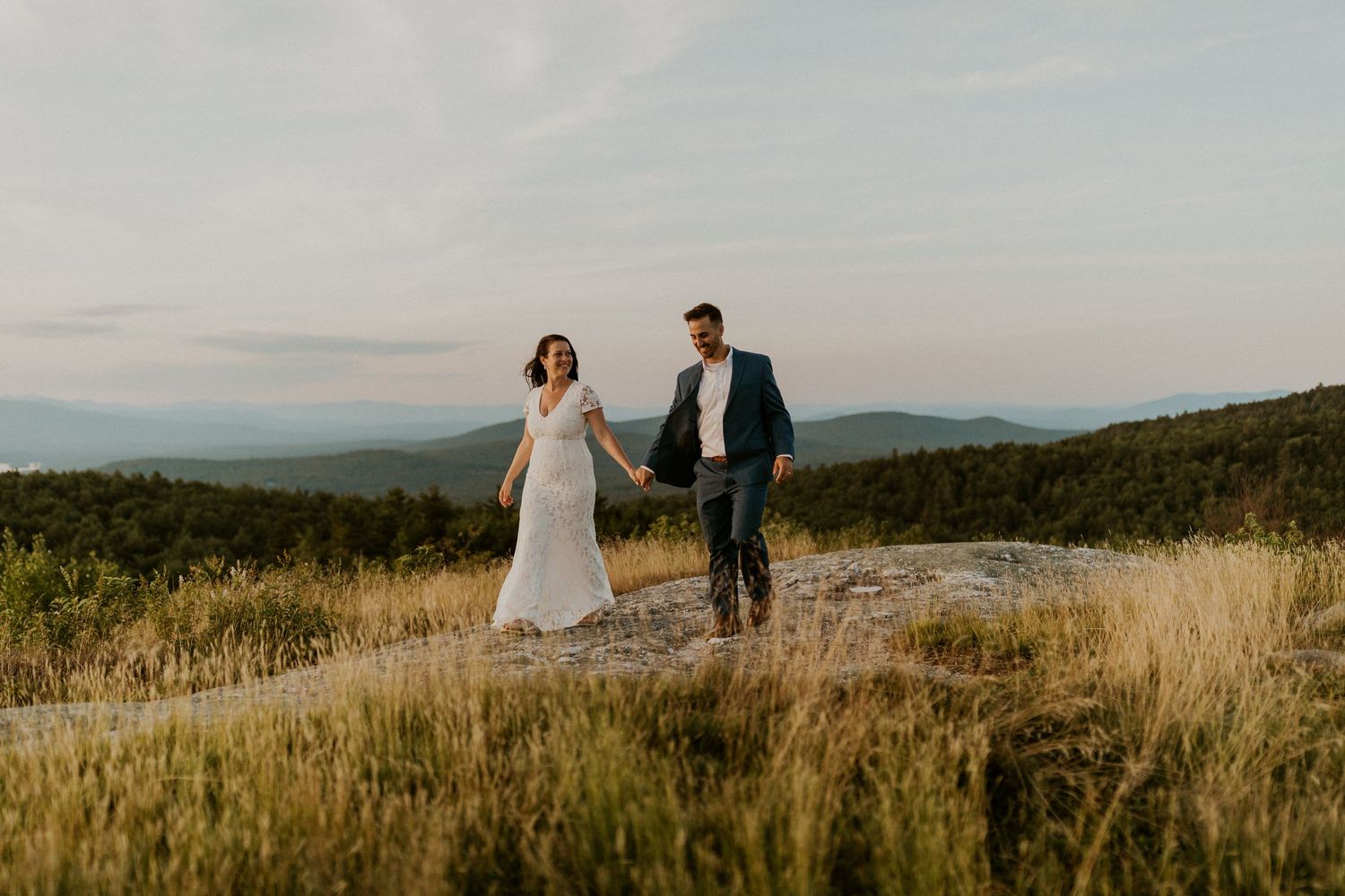 Danielle and Colin dressed in their wedding attire for their one year anniversary photoshoot on Foss Mountain in NH.