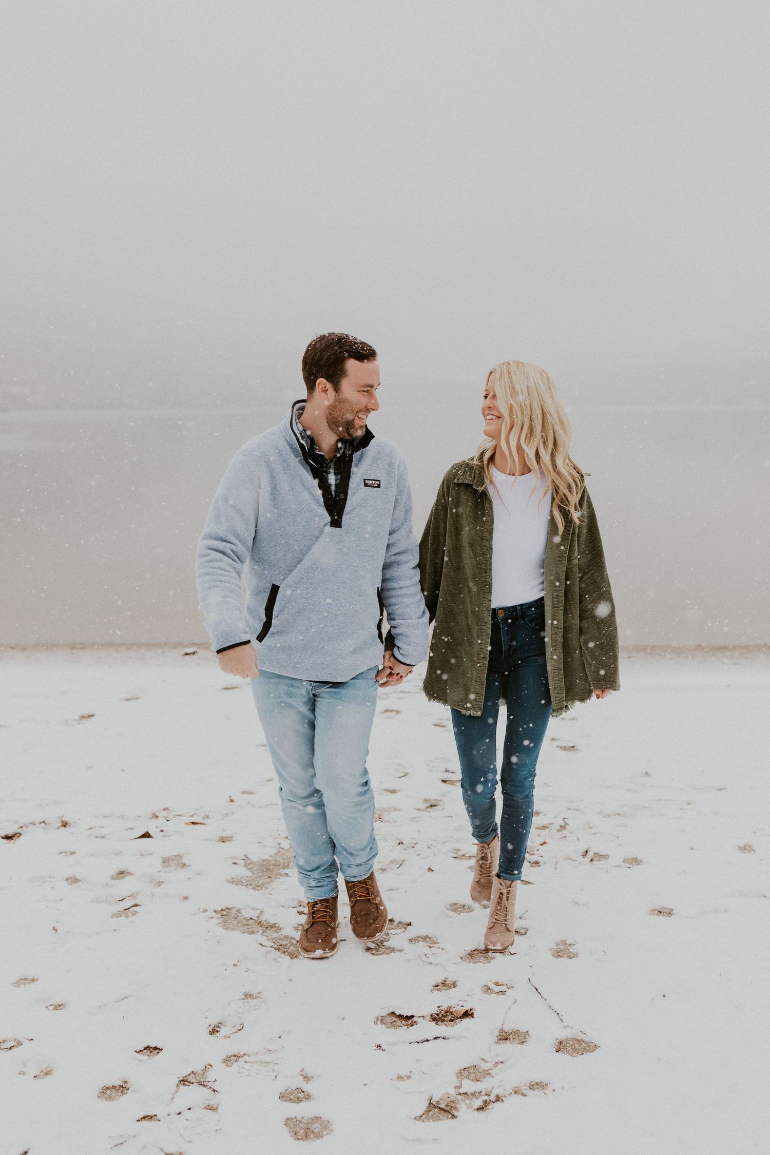 Newly engaged couple playfully posing for photos during their engagement session in Franconia New Hampshire.