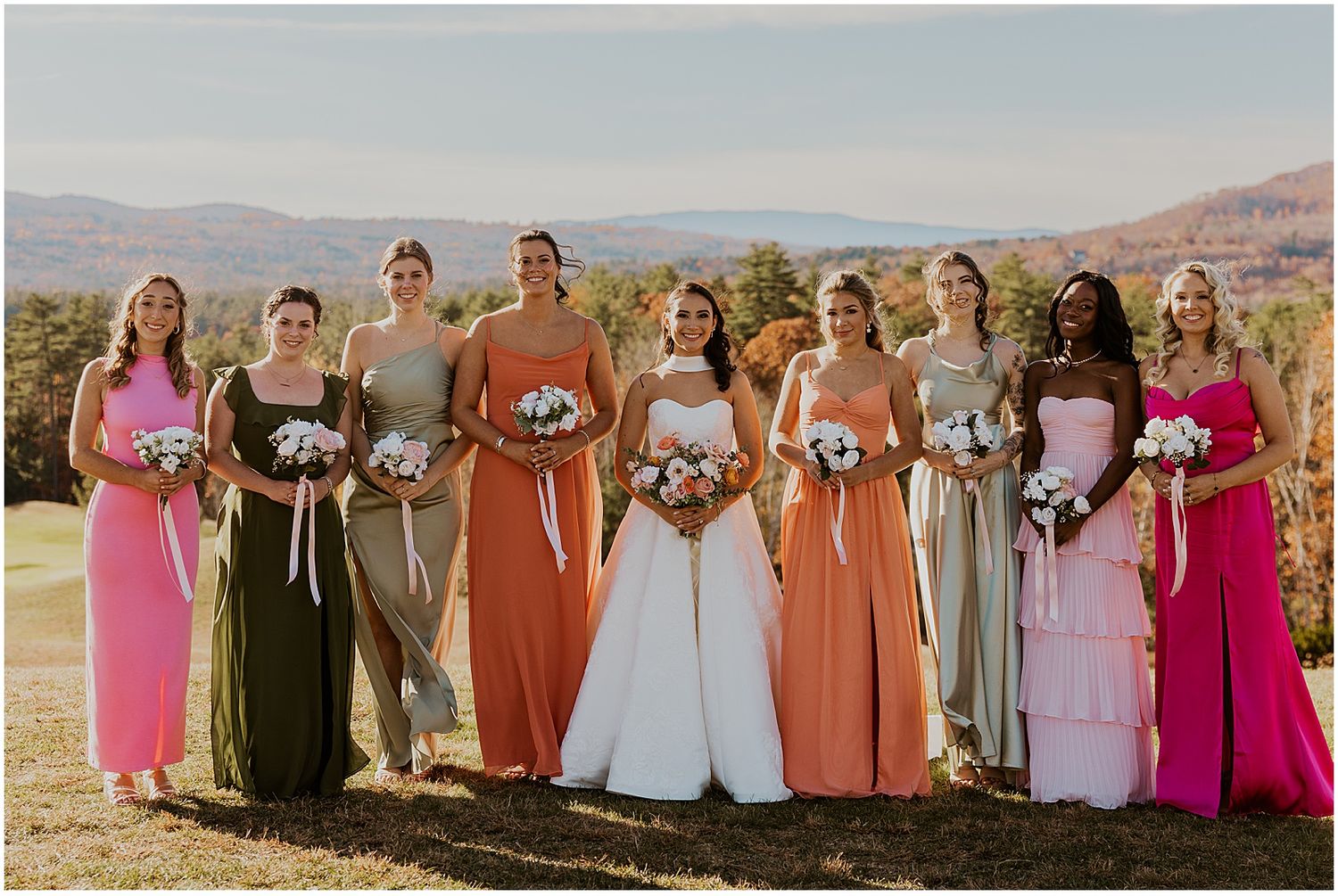 New Hampshire bride and bridesmaids taking golden hour wedding photos