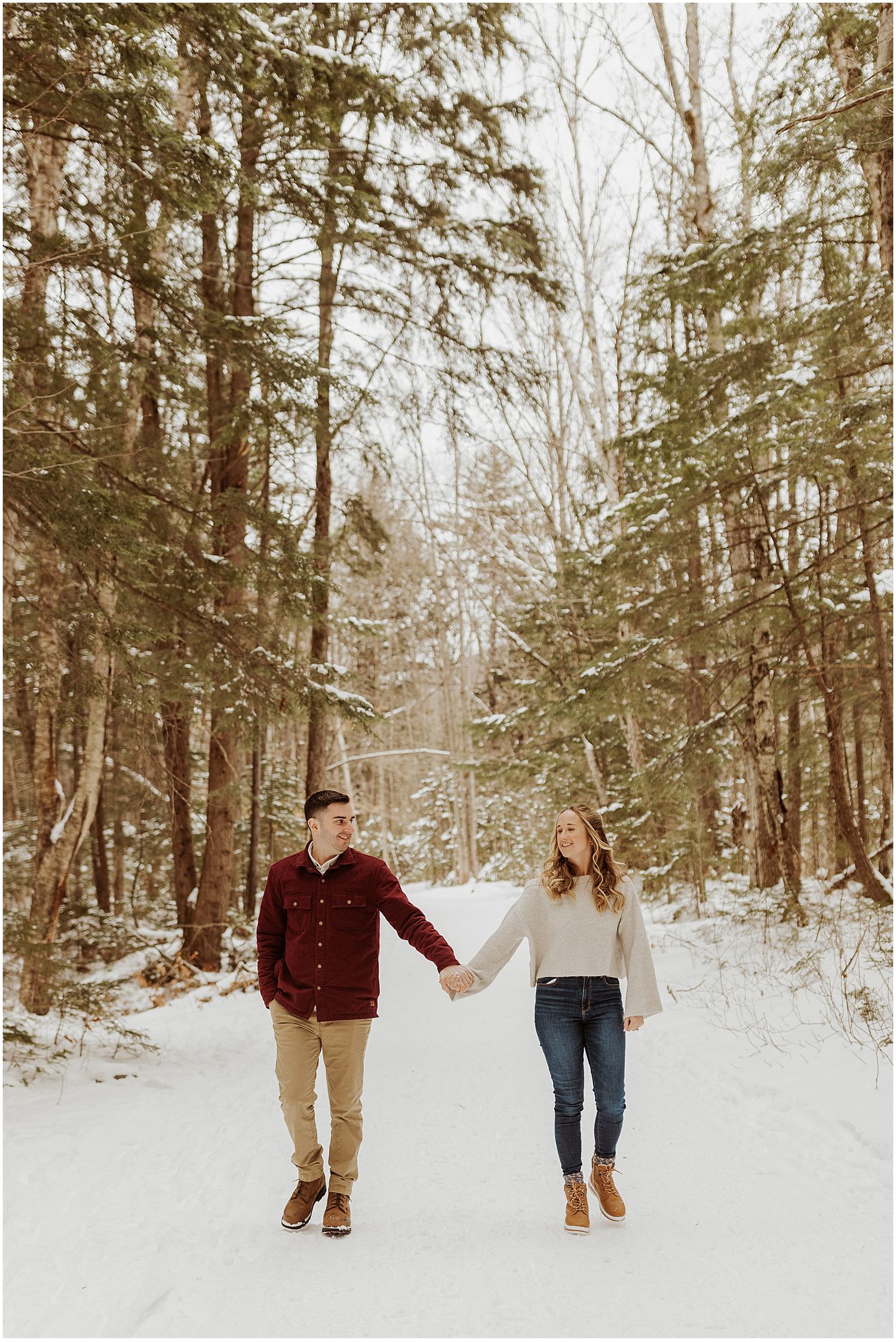 New Hampshire couple taking winter engagement photos in the white mountains