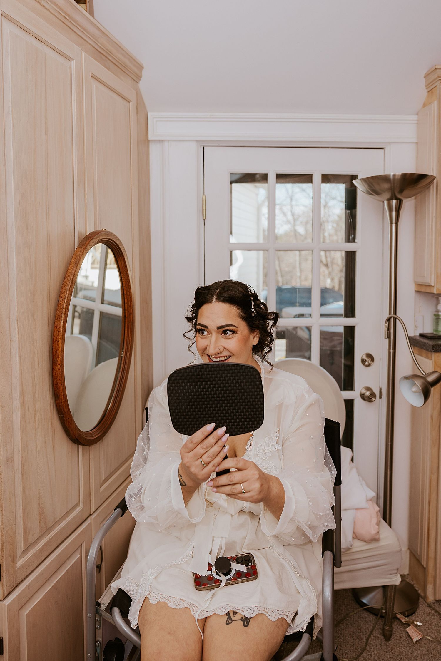 Bride getting he hair and makeup done for her NH wedding at the Barn at Powder Majors Farm