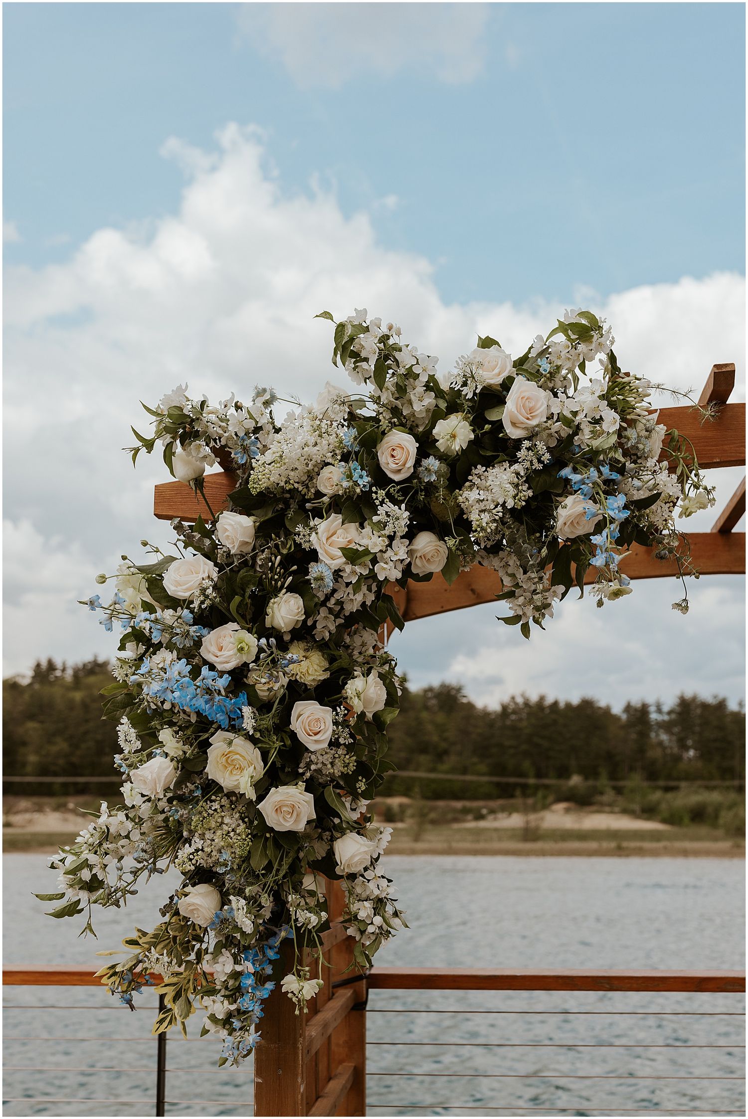 blue and white floral arch for wedding