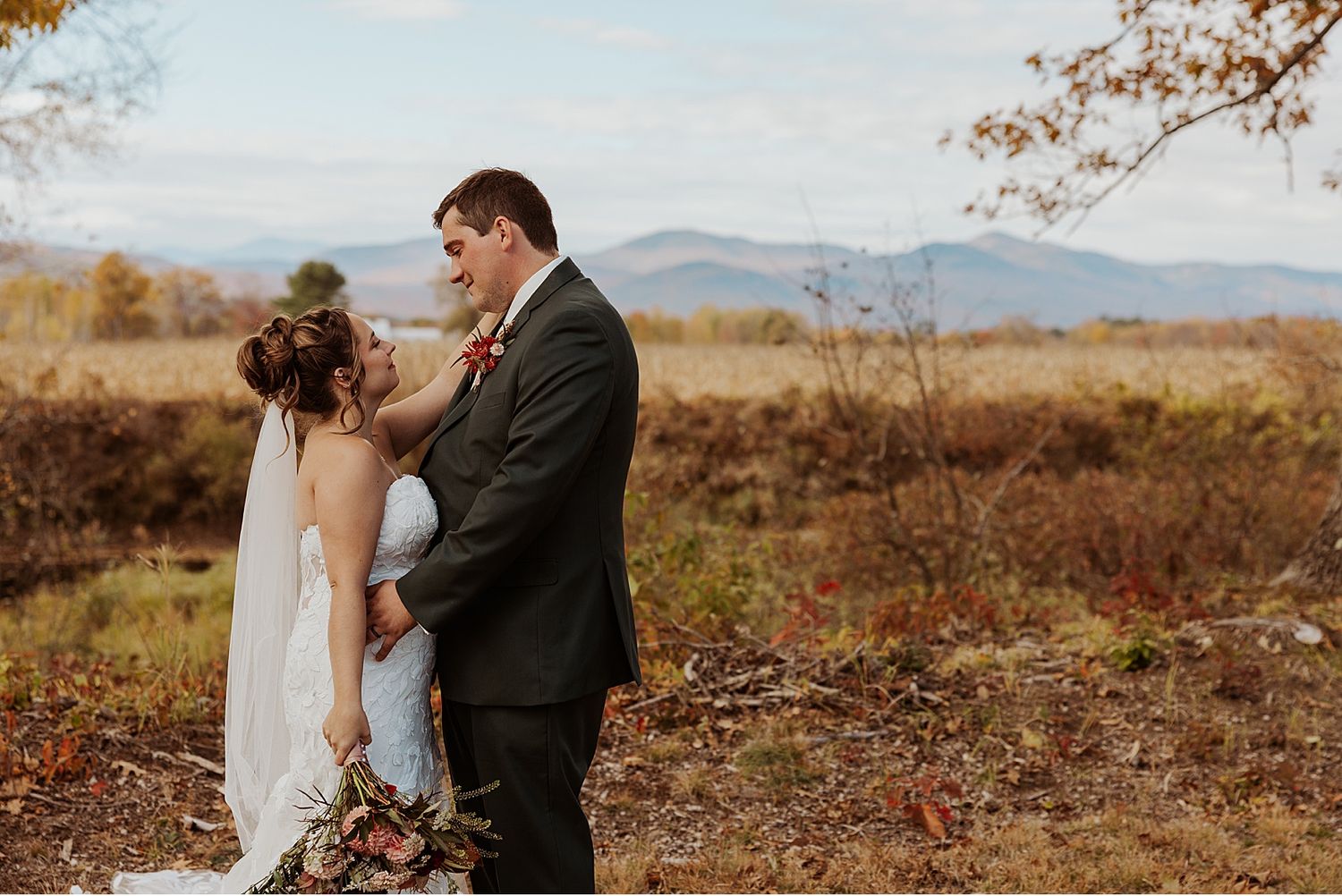 Bride and groom taking first look wedding photos at their NH wedding