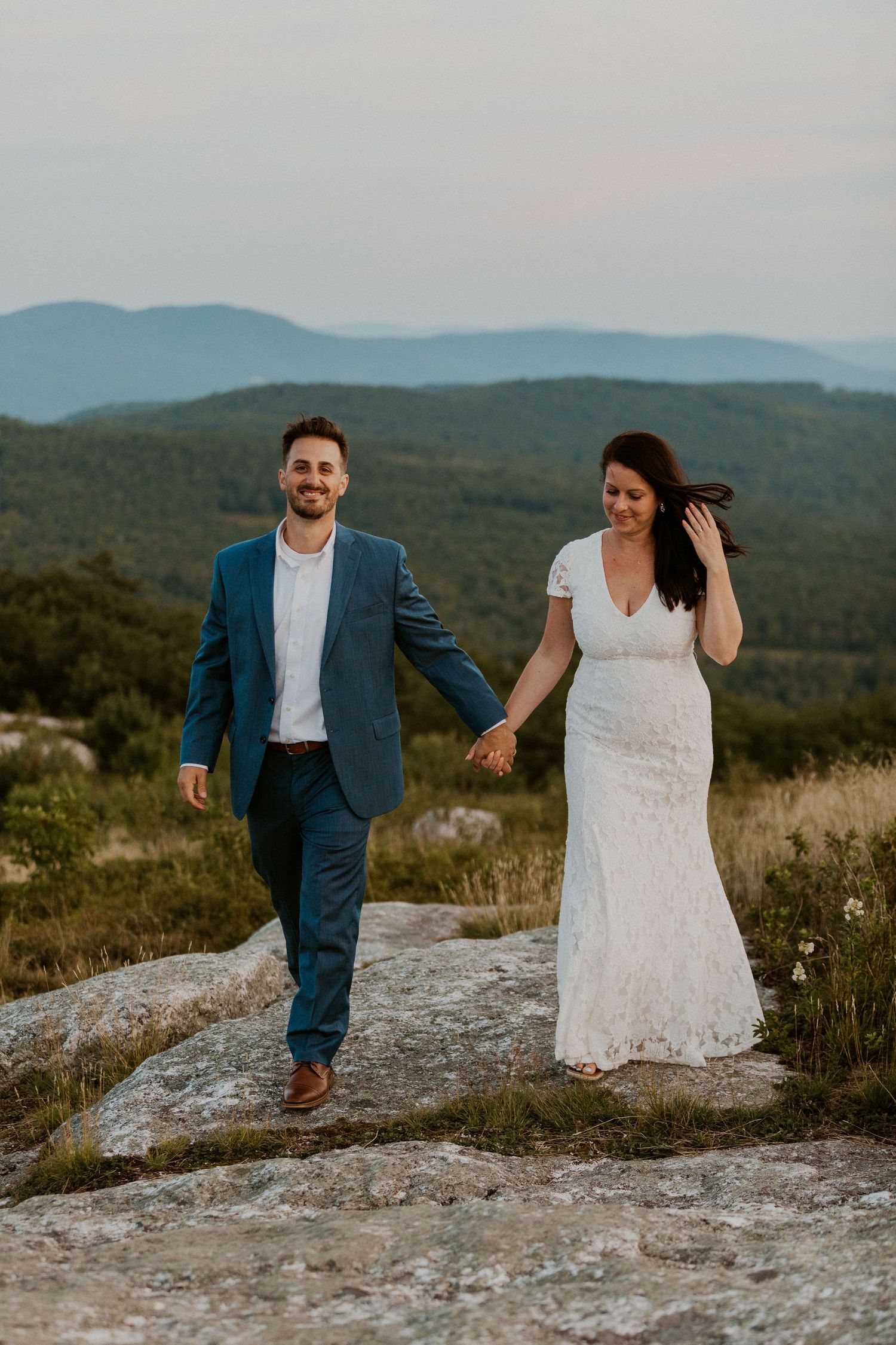 Danielle and Colin dressed in their wedding attire for their one year anniversary photoshoot on Foss Mountain in NH.