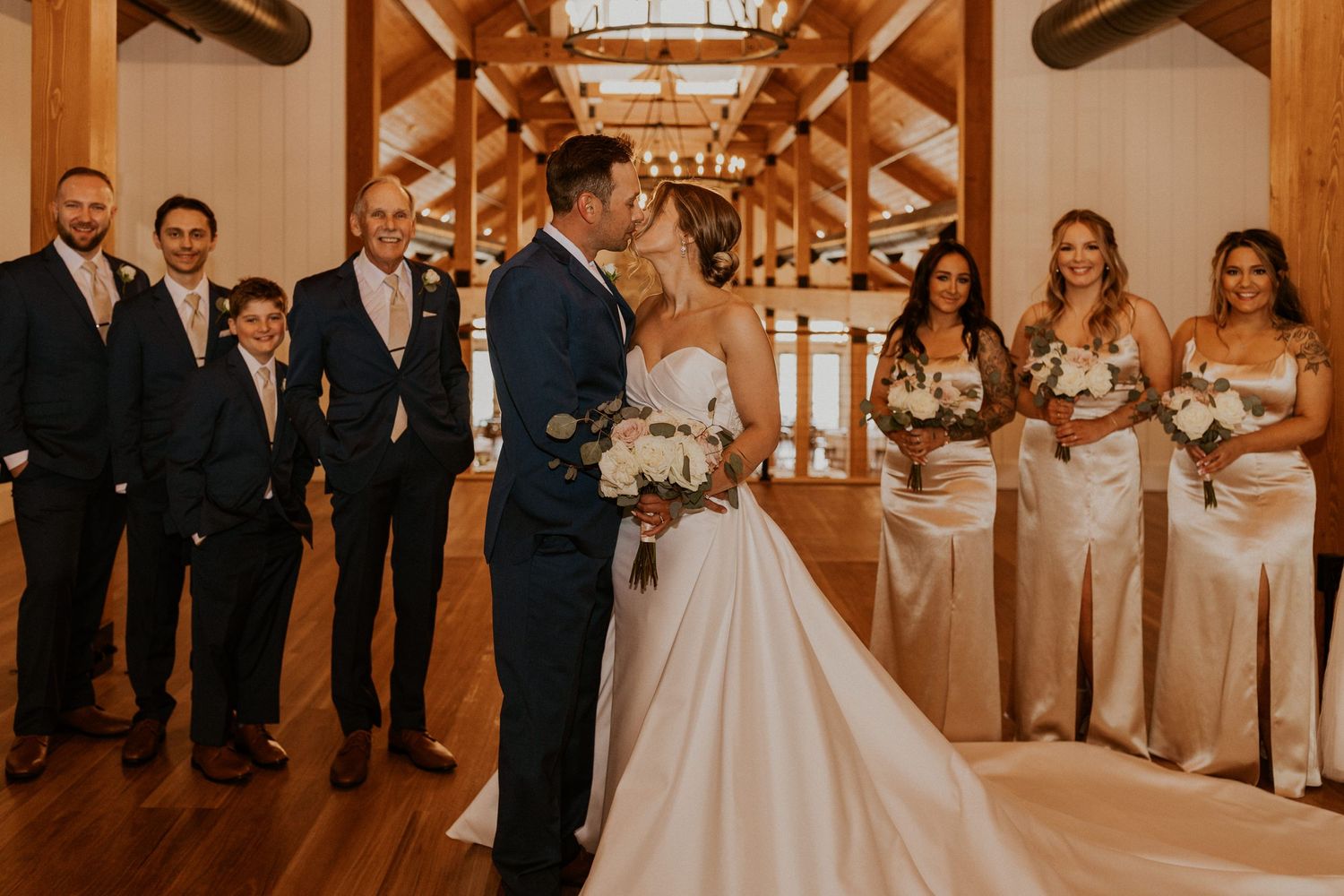 Wedding party photos taken in the lake house at owl's nest resort in thornton new hampshire.