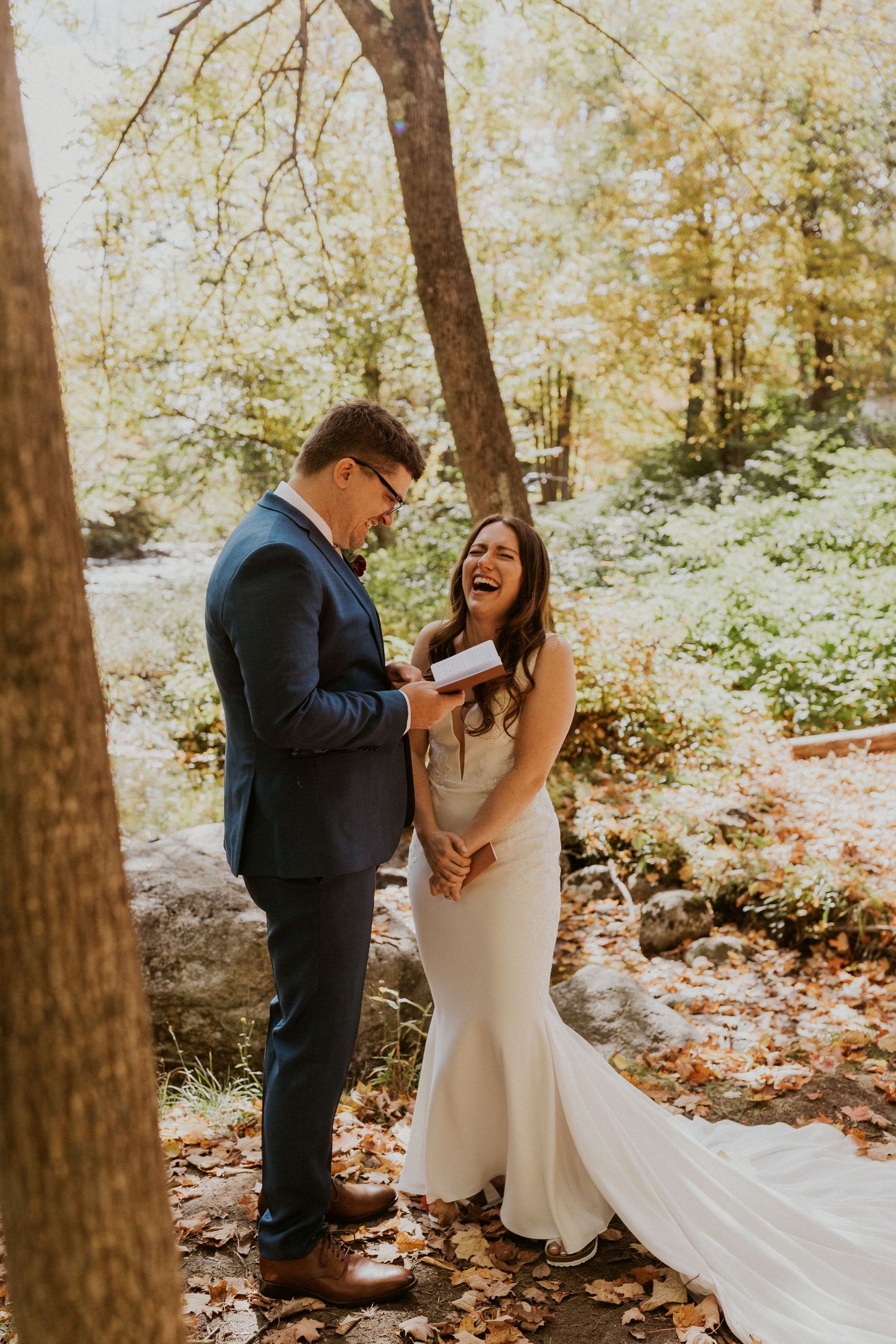 Daniel reading his private vows to Briana along the Pemi River in Woodstock New Hampshire.