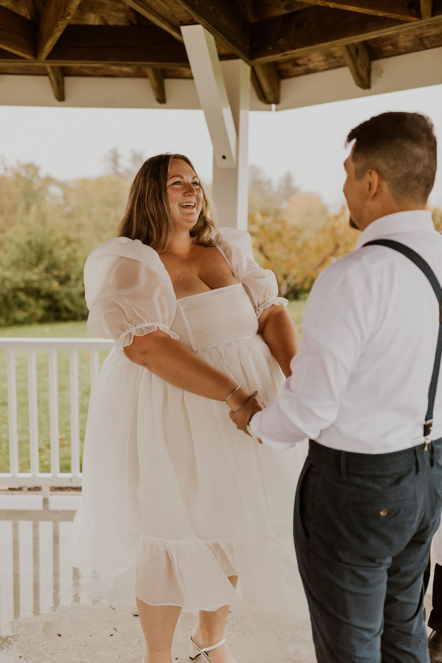 Terise smiling when reading her vows to Jose at their elopement in Penacook New Hampshire.