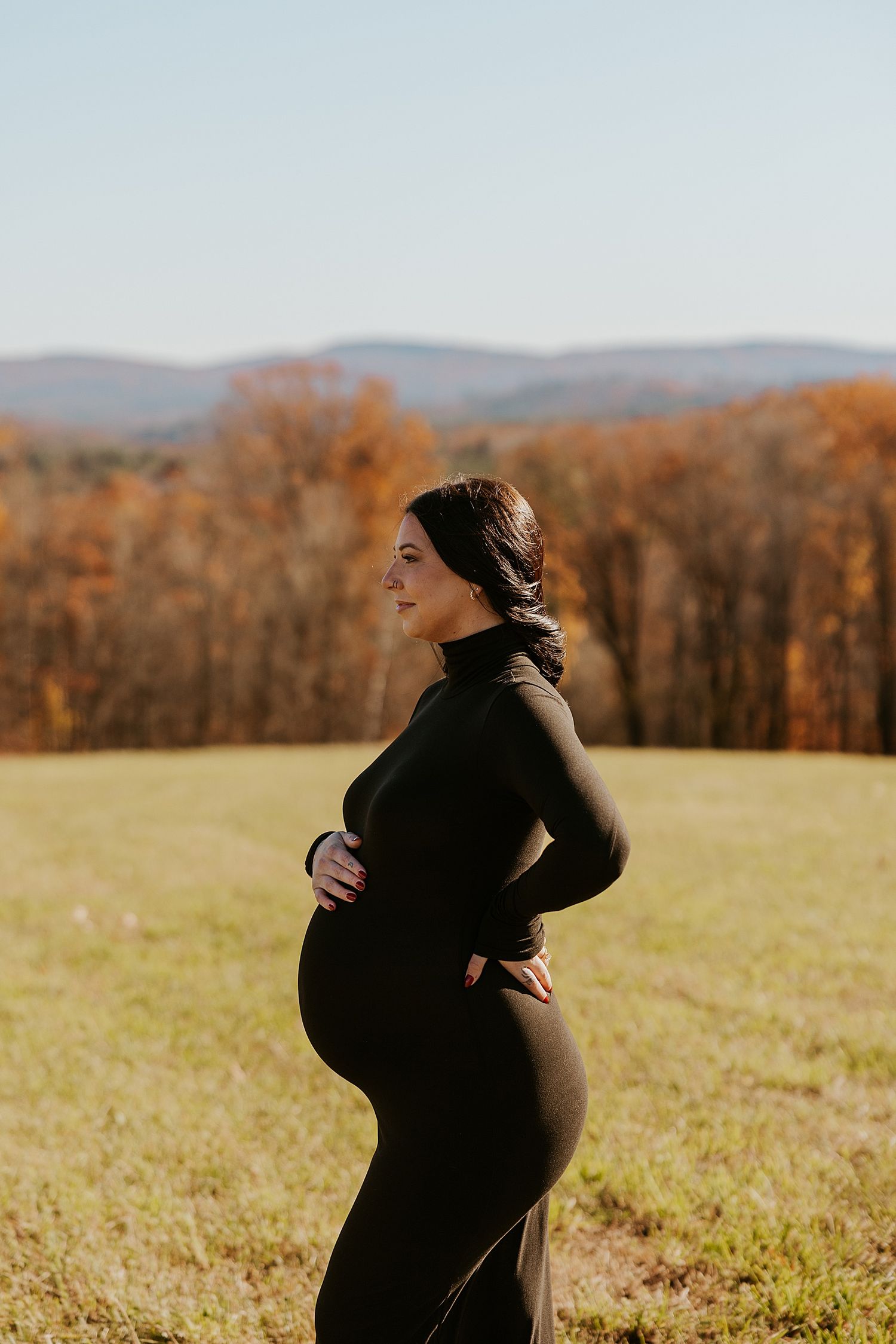 Woman doing a maternity New Hampshire photoshoot