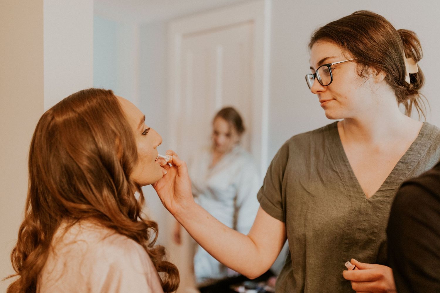 Chrissy having her hair and makeup done before her wedding ceremony at the Arabella Estate in Buxton Maine