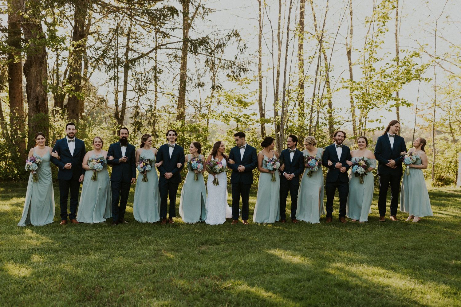 Wedding party walking and talking.